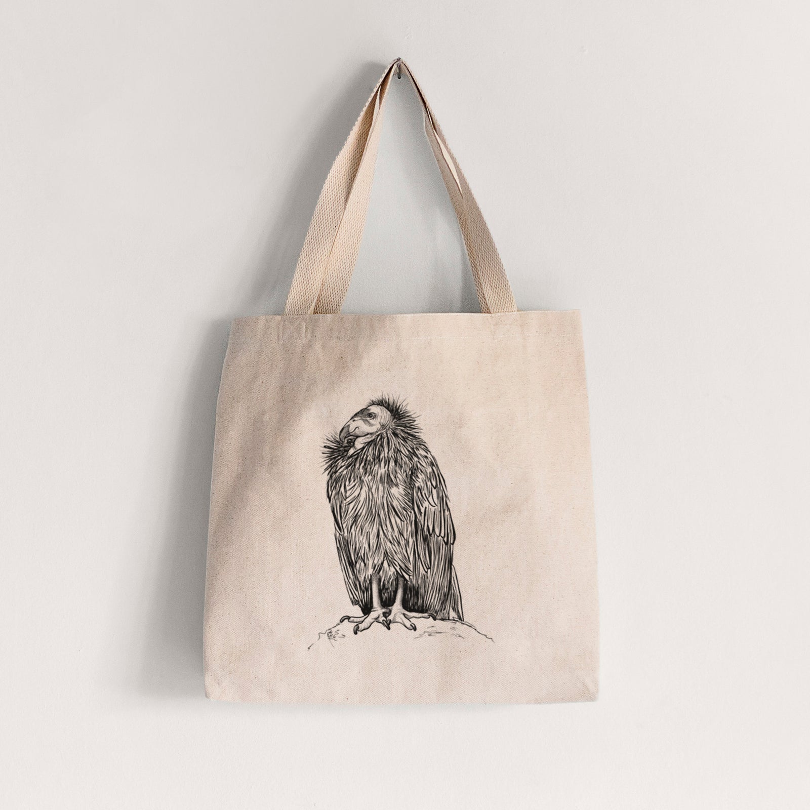 Natural canvas tote bag printed with a detailed black ink illustration of a California condor perched with folded wings.