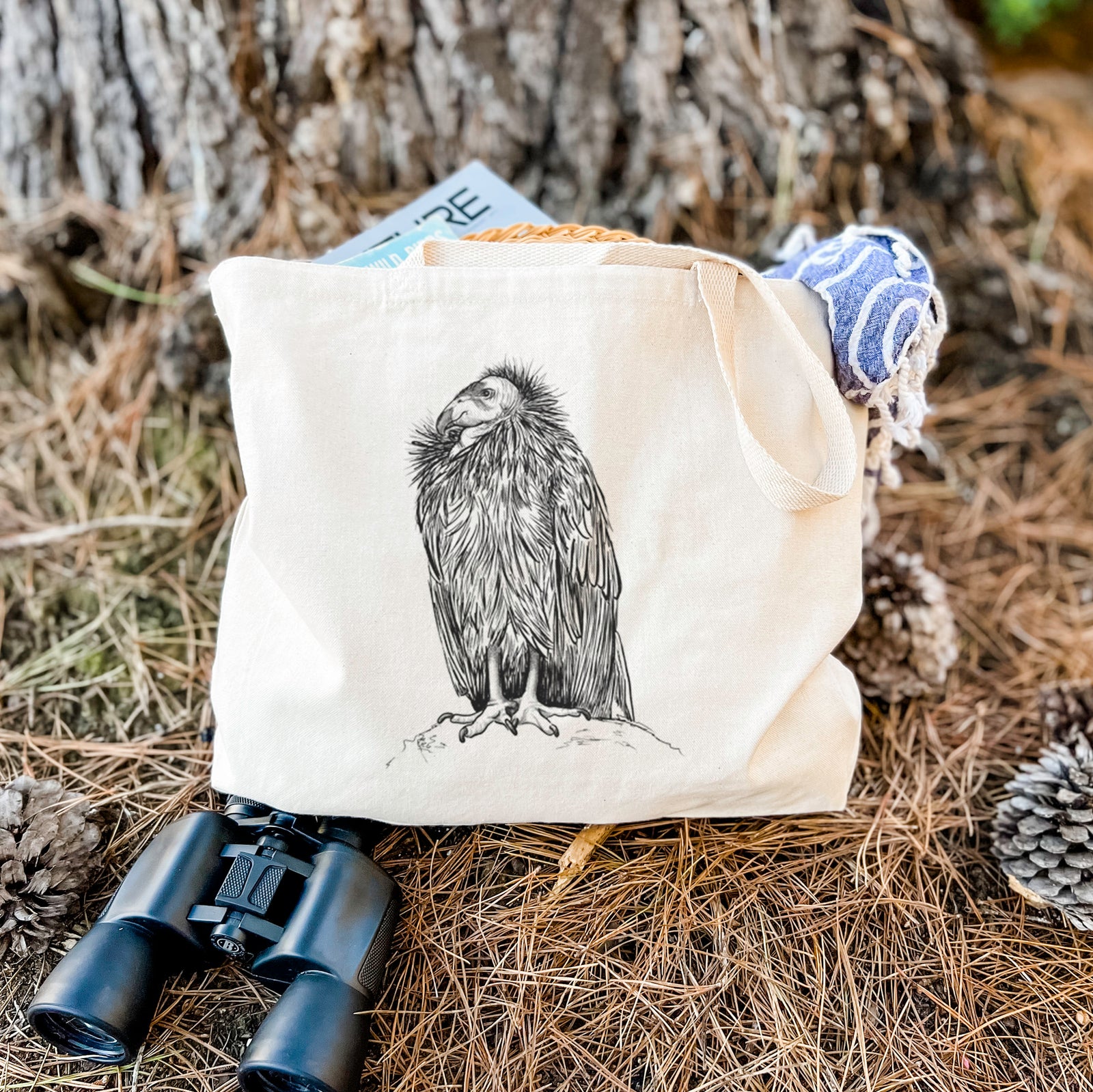 Natural canvas tote bag printed with a detailed black ink illustration of a California condor perched with folded wings.