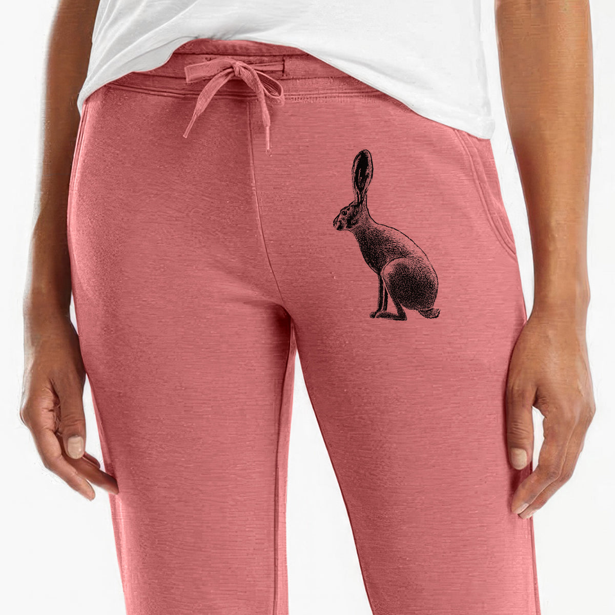 Front of dusty rose Cali Wave sweatpants, printed with a detailed black ink illustration of a black-tailed jackrabbit sitting in profile with tall ears on the leg.