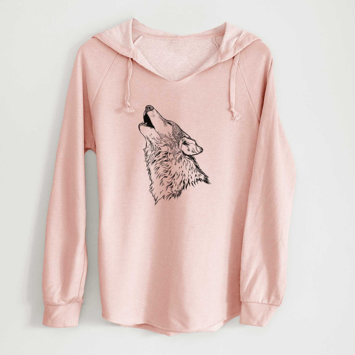 Blush pink women's Cali Wave hooded sweatshirt laid flat, printed with a detailed black ink illustration of a grey wolf's head and shoulders, howling upward.
