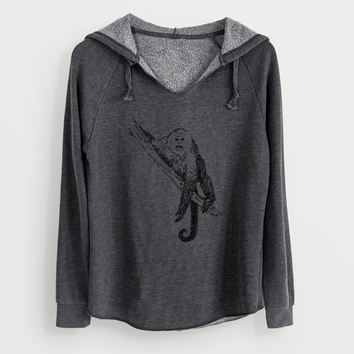 Charcoal grey women's Cali Wave hooded sweatshirt laid flat, printed with a detailed black ink illustration of a capuchin monkey climbing a branch.