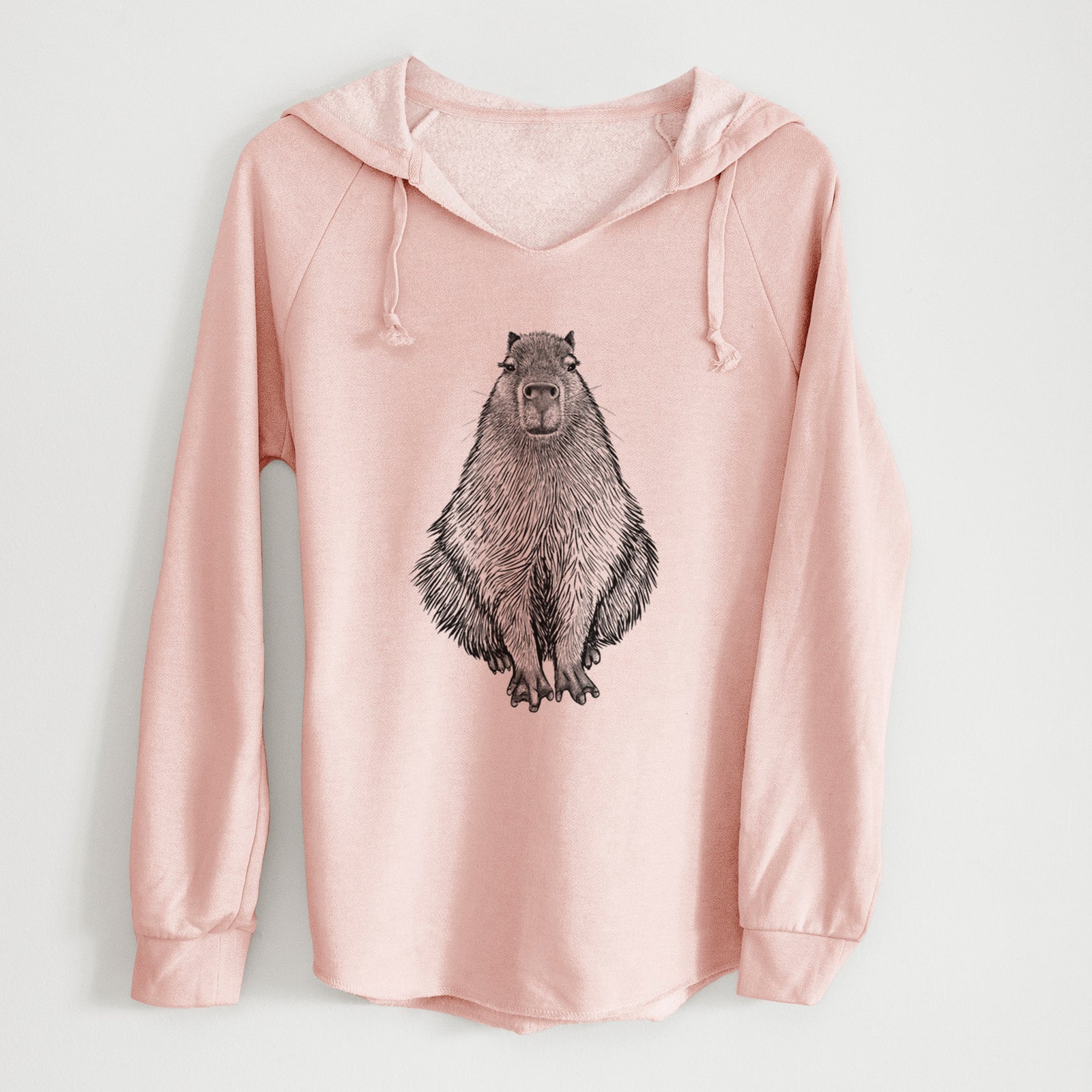 Sage green women's Cali Wave hooded sweatshirt laid flat, printed with a detailed black ink illustration of a capybara sitting and facing forward.