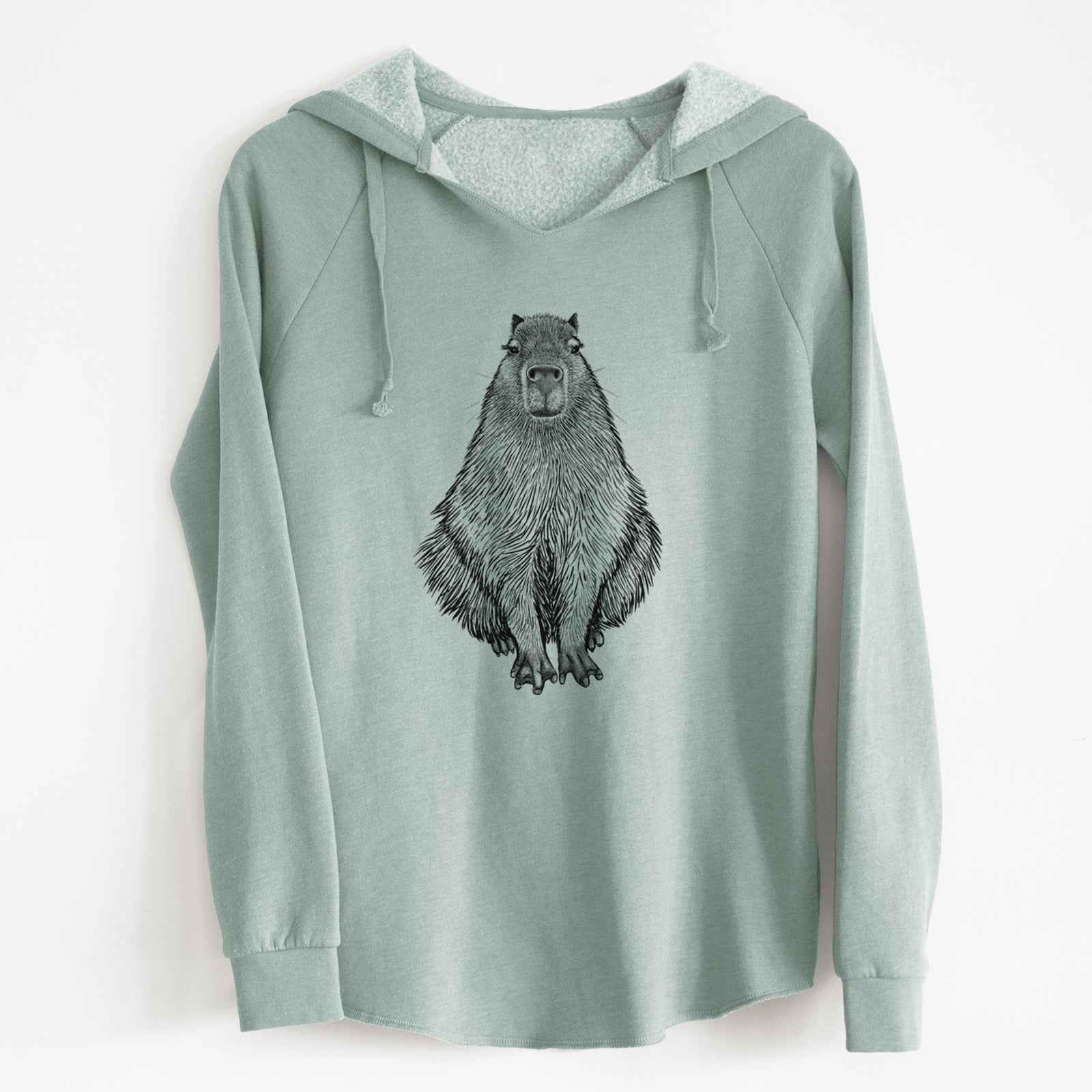 Sage green women's Cali Wave hooded sweatshirt laid flat, printed with a detailed black ink illustration of a capybara sitting and facing forward.