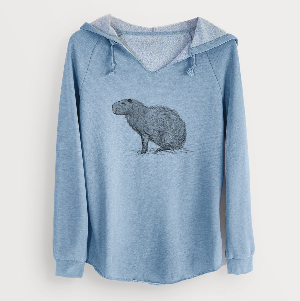 Misty blue women's Cali Wave hooded sweatshirt laid flat, printed with a detailed black ink illustration of a capybara standing in profile.