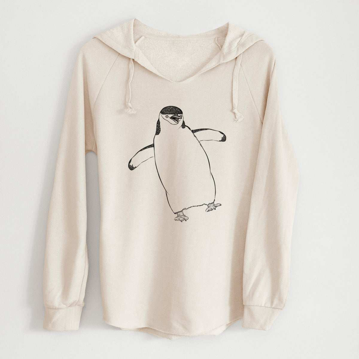 Bone cream women's Cali Wave hooded sweatshirt laid flat, printed with a black ink illustration of a chinstrap penguin standing with its flippers out.
