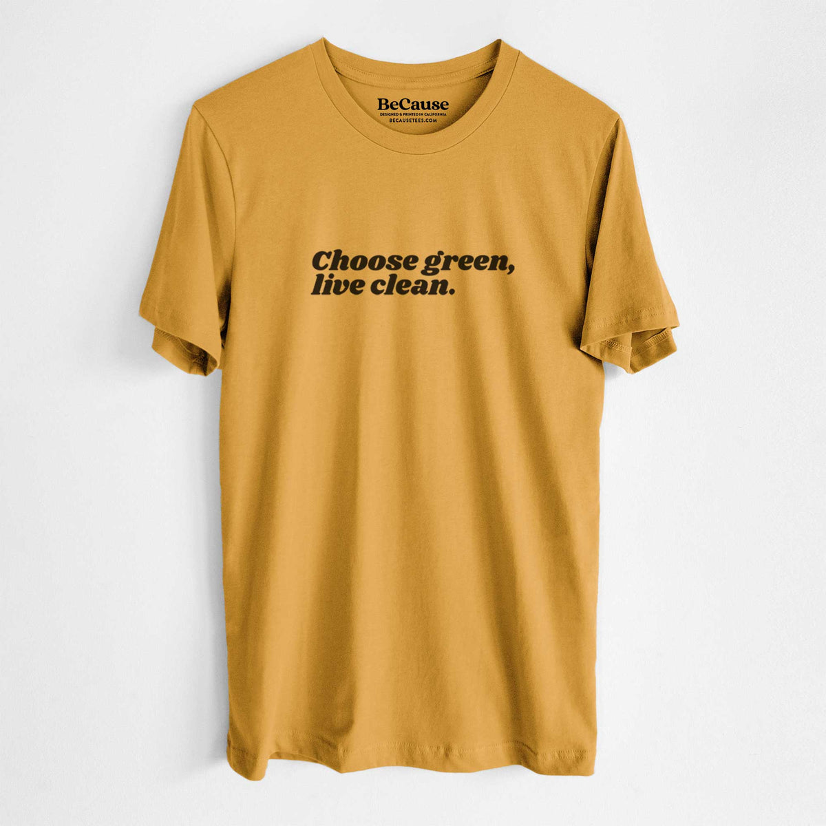 Mustard yellow lightweight cotton t-shirt laid flat, printed with small black script words reading Choose Green, Live Clean on the upper chest.