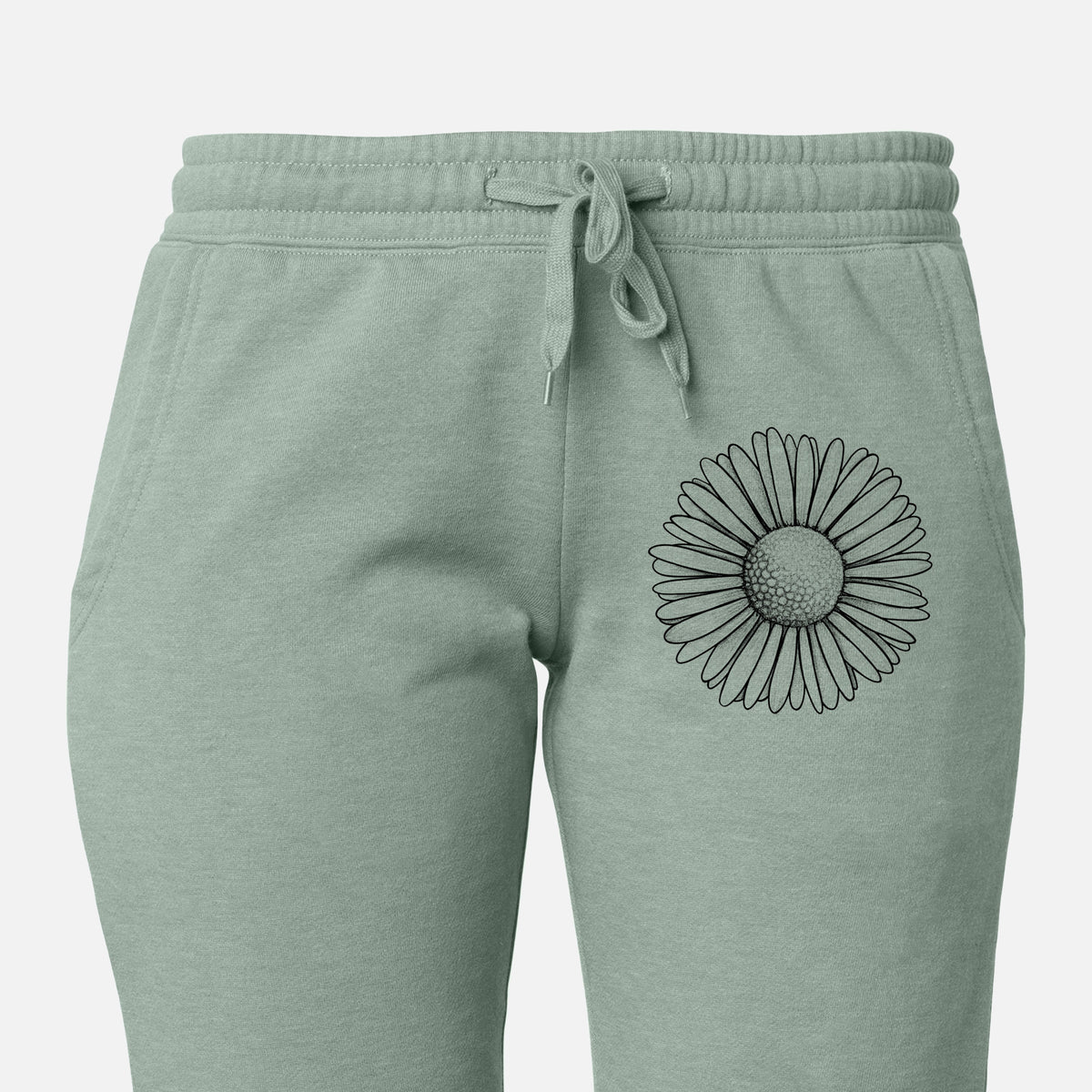 Front of sage green Cali Wave sweatpants, printed with a detailed black ink line drawing of a single common daisy flower on the leg.