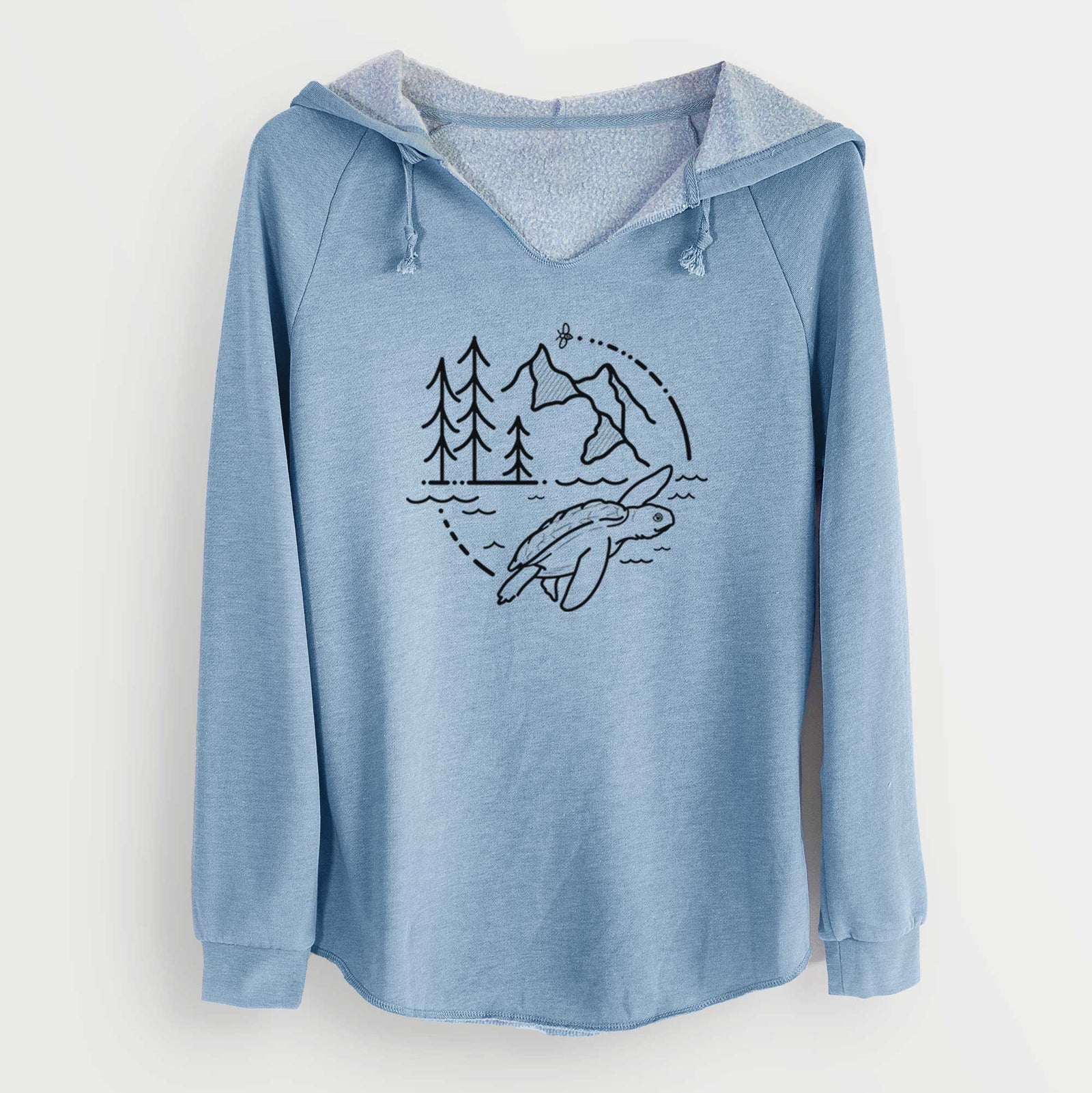 Misty blue women's Cali Wave hooded sweatshirt laid flat, printed with a black line art circle connecting pine trees, mountains, a bee and a Kemp's ridley sea turtle swimming.
