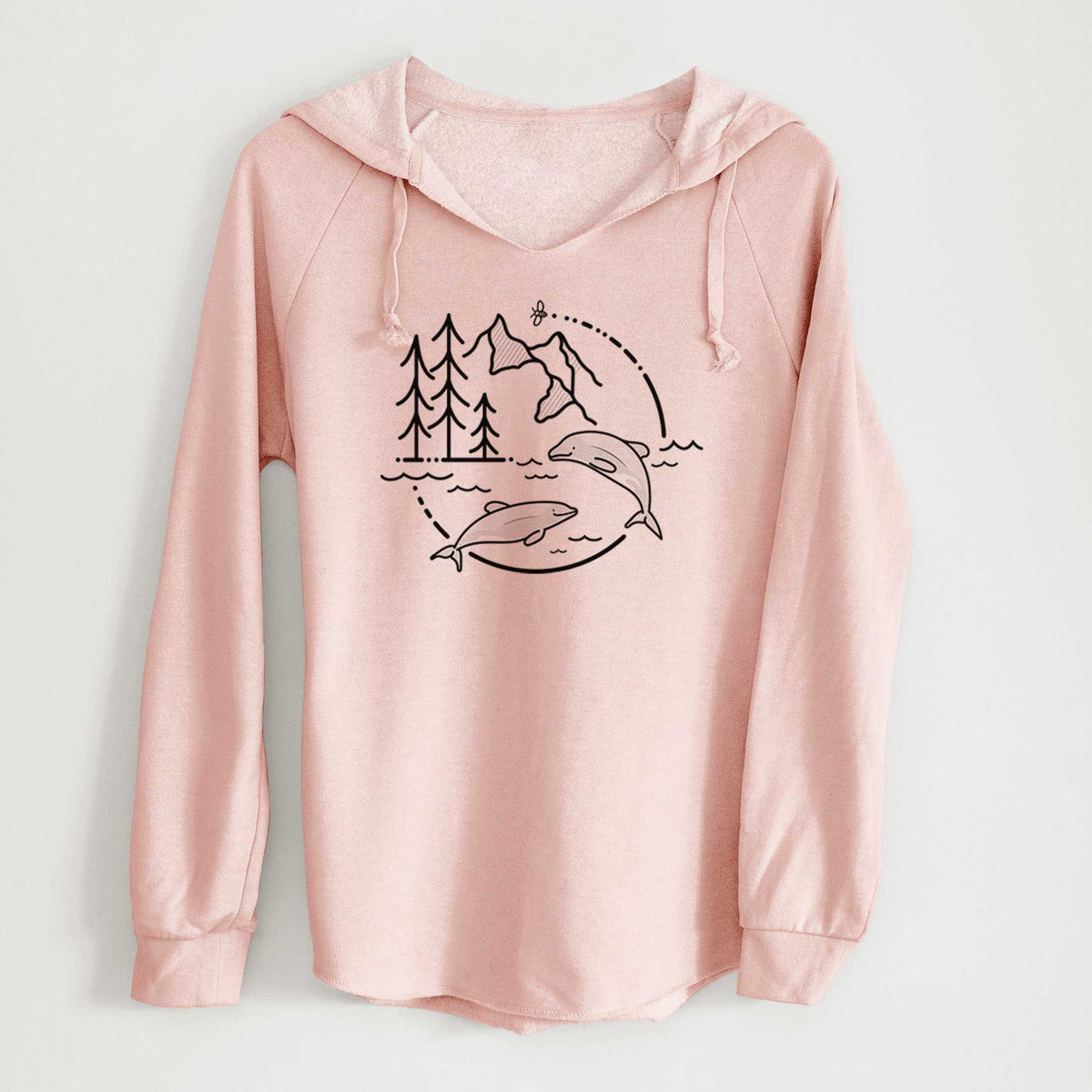 Blush pink women's Cali Wave hooded sweatshirt laid flat, printed with a black line art circle connecting pine trees, mountains, a bee and two Maui dolphins leaping from the waves.