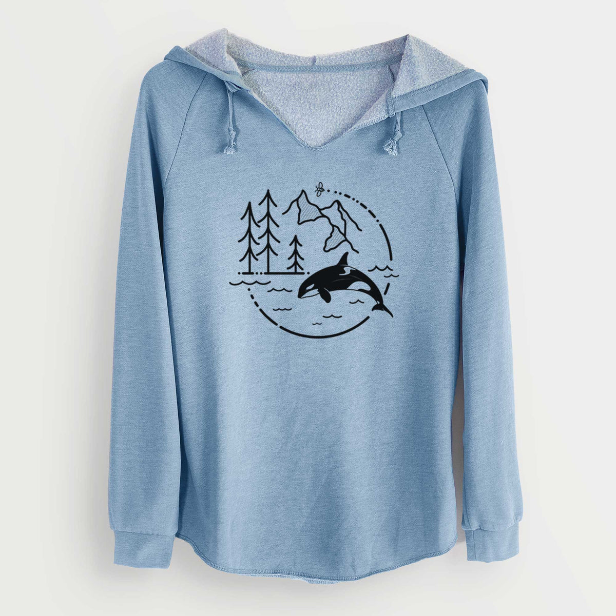 Misty blue women's Cali Wave hooded sweatshirt laid flat, printed with a black line art circle connecting pine trees, mountains, a bee and an orca leaping from ocean waves.