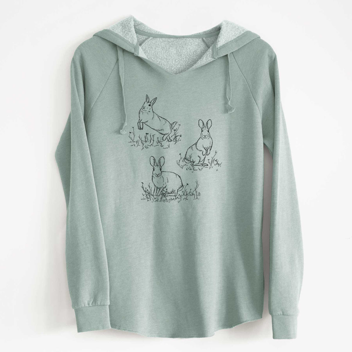 Sage green women's Cali Wave hooded sweatshirt laid flat, printed with a black ink illustration of three cottontail rabbits among grass and flowers.