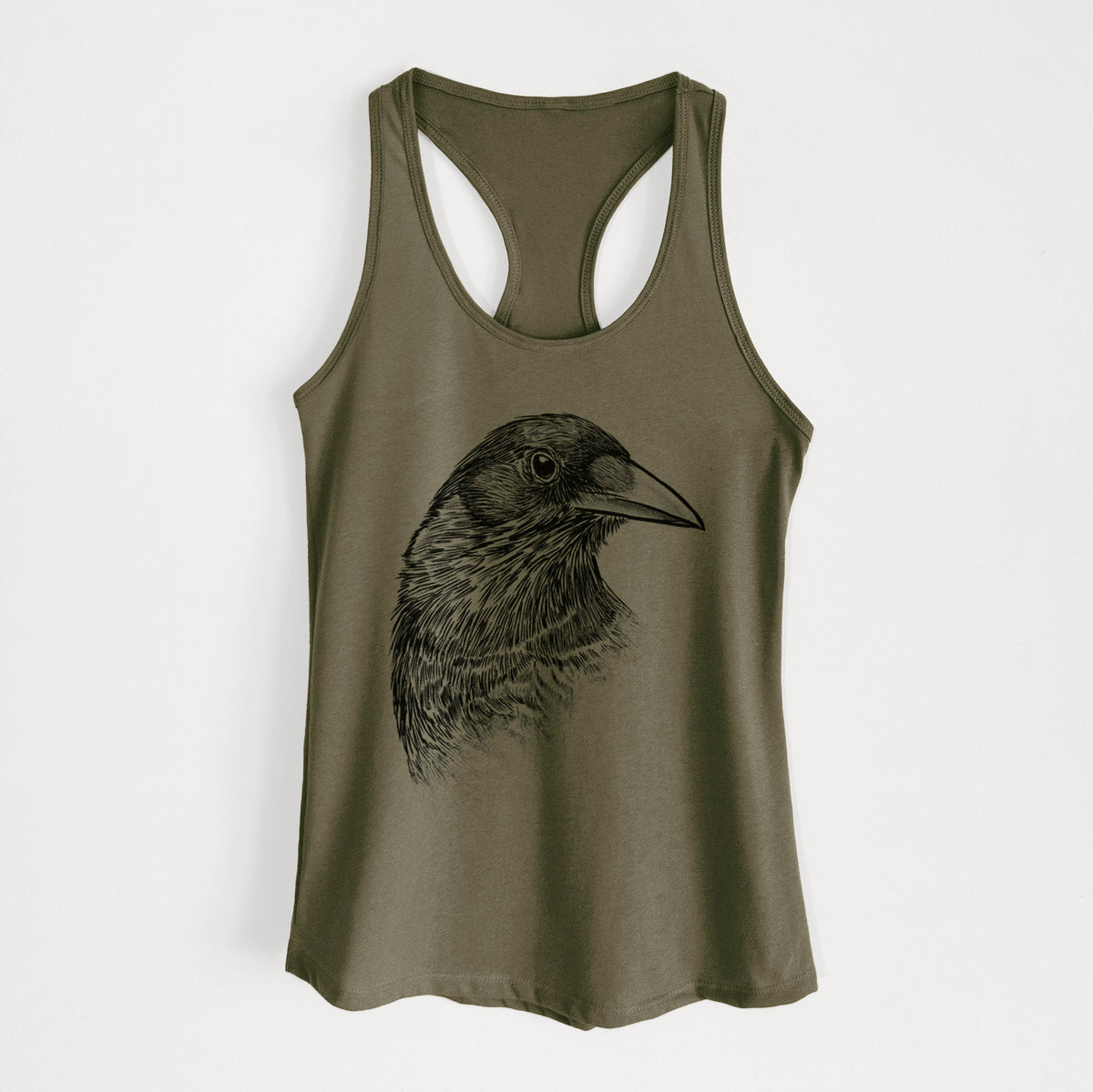 Military green women's racerback tank top laid flat, printed with a detailed black ink portrait of a crow's head in profile.