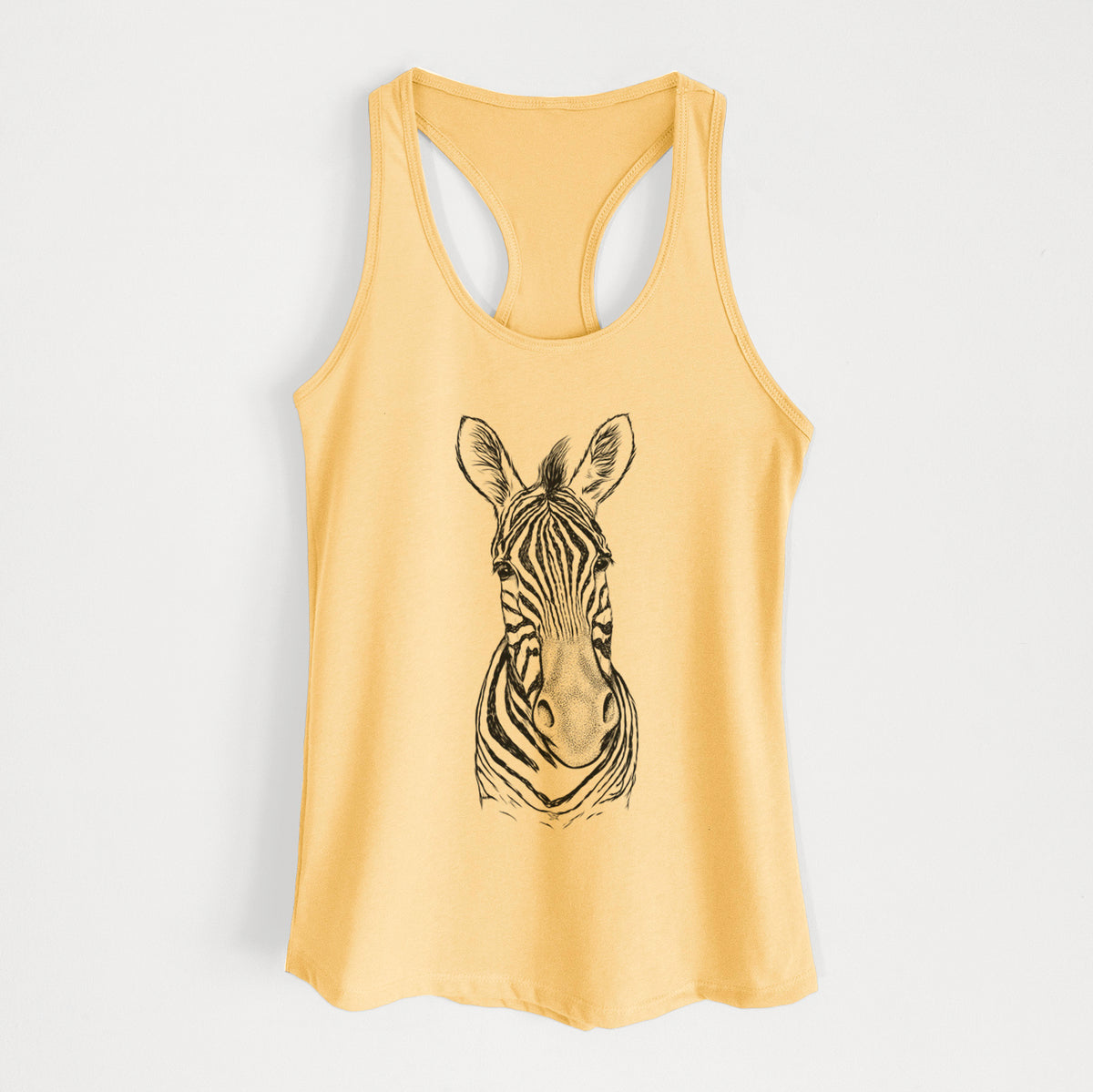 Banana cream women's racerback tank top laid flat, printed with a detailed black ink portrait of a Damara zebra facing forward.
