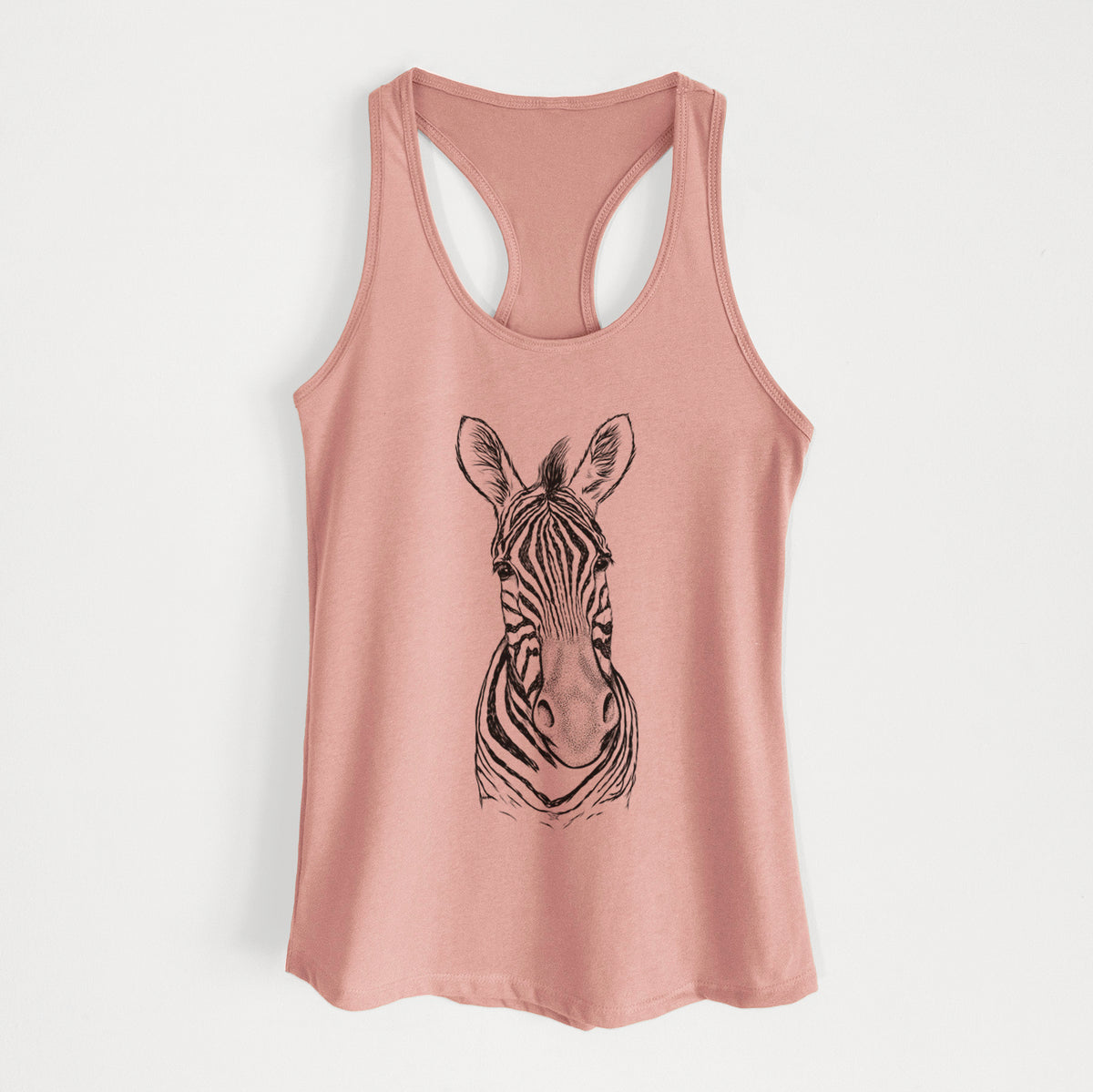 Desert pink women's racerback tank top laid flat, printed with a detailed black ink portrait of a Damara zebra facing forward.