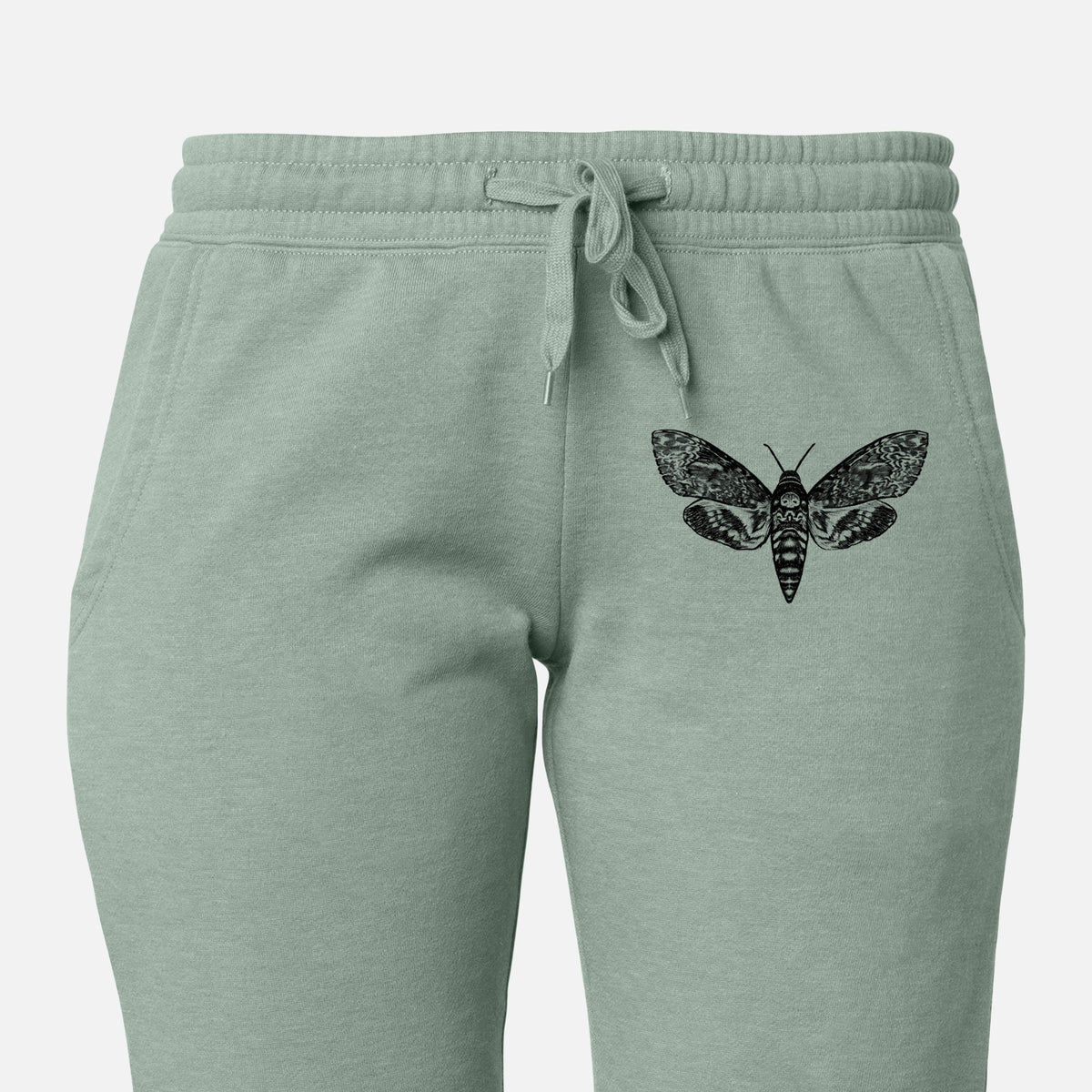 Front of sage green Cali Wave sweatpants, printed with a detailed black ink illustration of a death's-head hawkmoth with its wings spread on the leg.