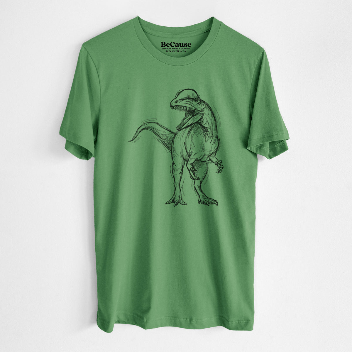 Leaf green lightweight cotton t-shirt laid flat, printed with a black ink illustration of a Dilophosaurus with its neck frill, walking.