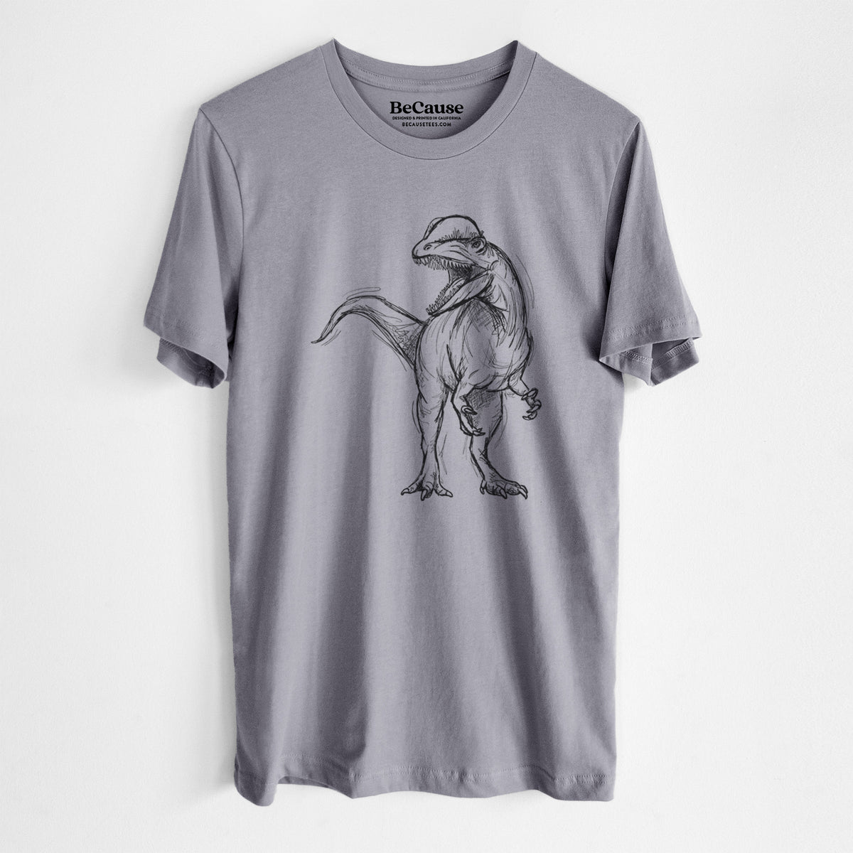 Storm grey lightweight cotton t-shirt laid flat, printed with a black ink illustration of a Dilophosaurus with its neck frill, walking.
