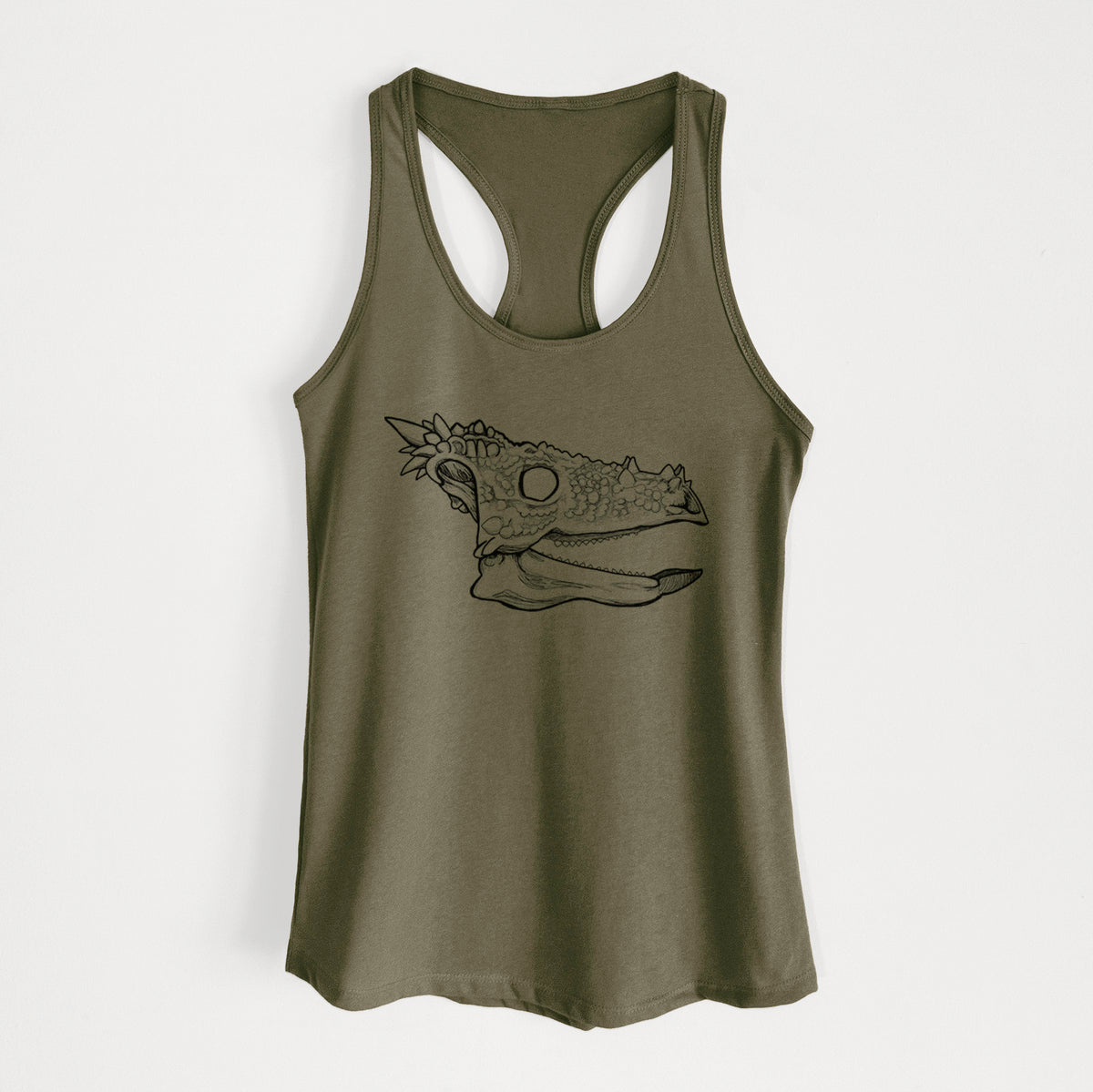 Military green women's racerback tank top laid flat, printed with a black ink illustration of a spiky Dracorex dinosaur skull.