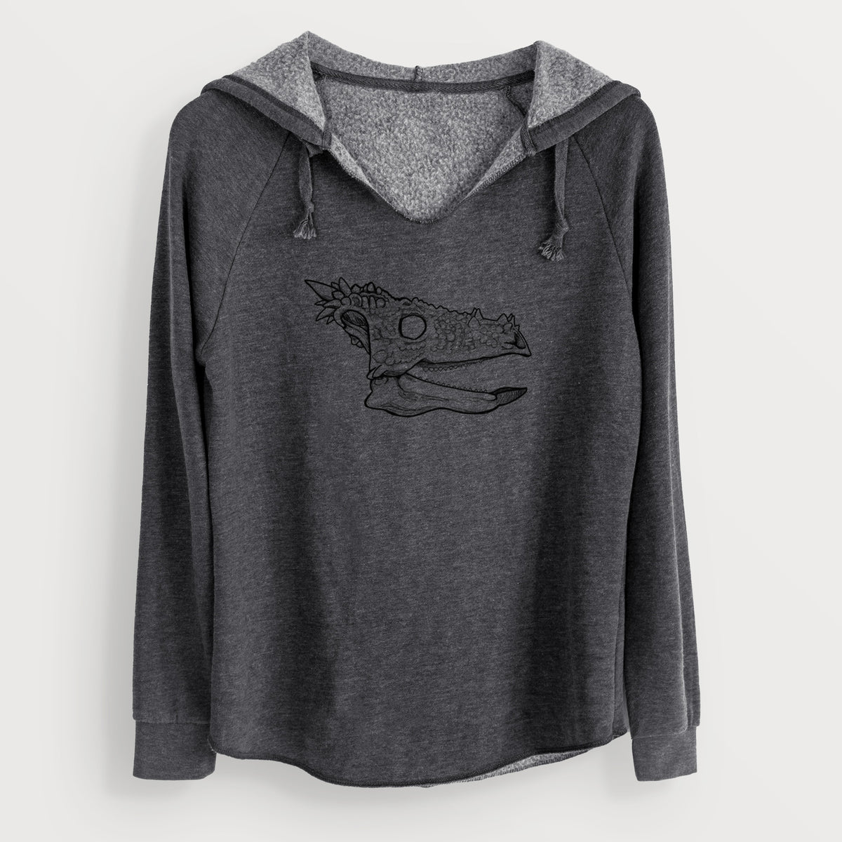 Charcoal grey women's Cali Wave hooded sweatshirt laid flat, printed with a black ink illustration of a spiky Dracorex dinosaur skull.
