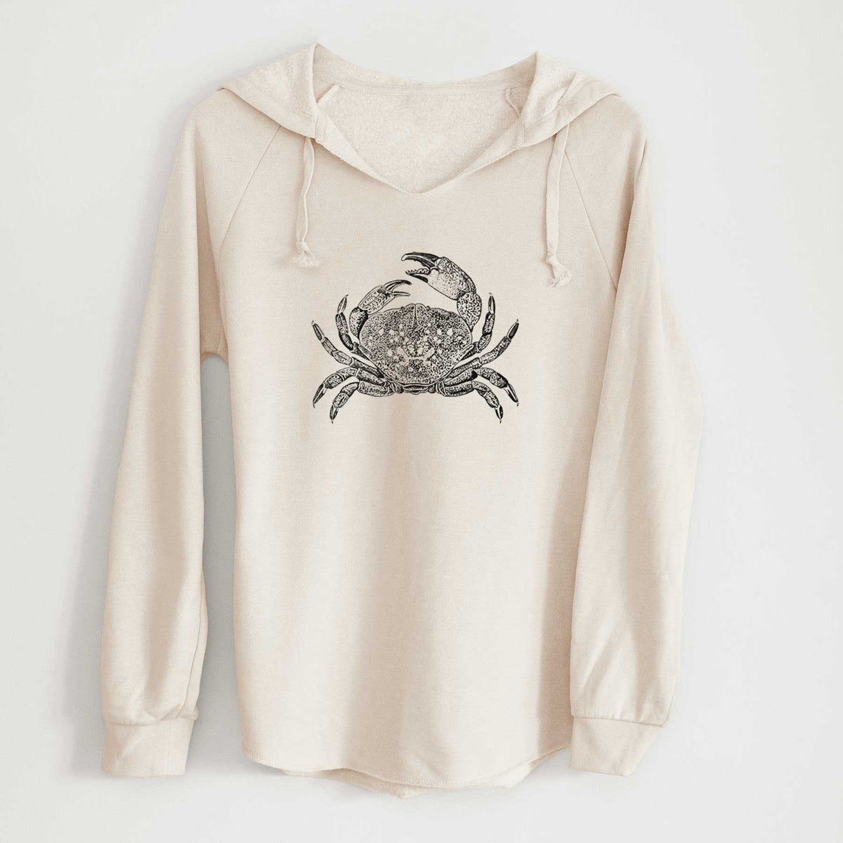 Bone cream women's Cali Wave hooded sweatshirt laid flat, printed with a detailed black ink illustration of a Dungeness crab with claws raised, seen from above.