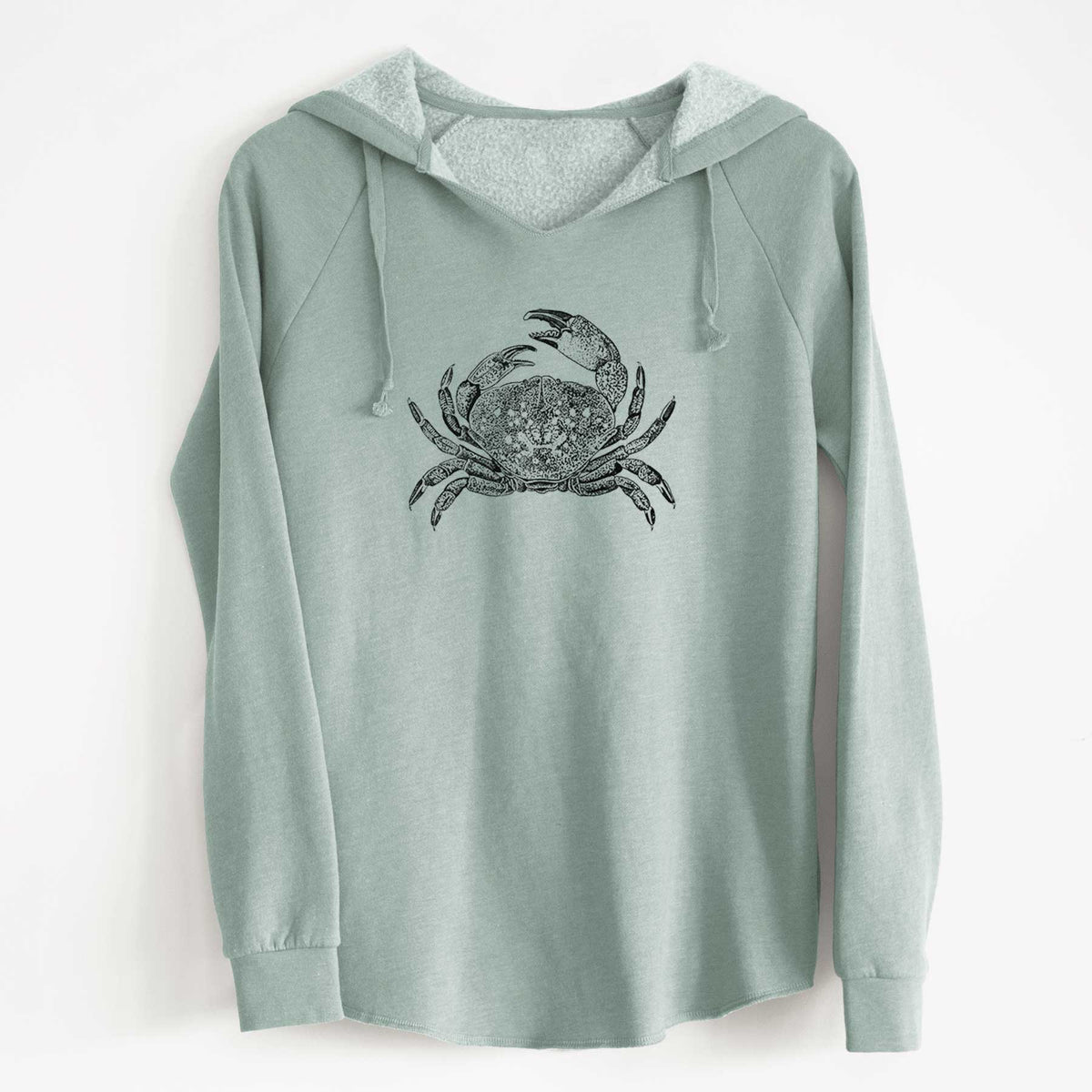 Sage green women's Cali Wave hooded sweatshirt laid flat, printed with a detailed black ink illustration of a Dungeness crab with claws raised, seen from above.