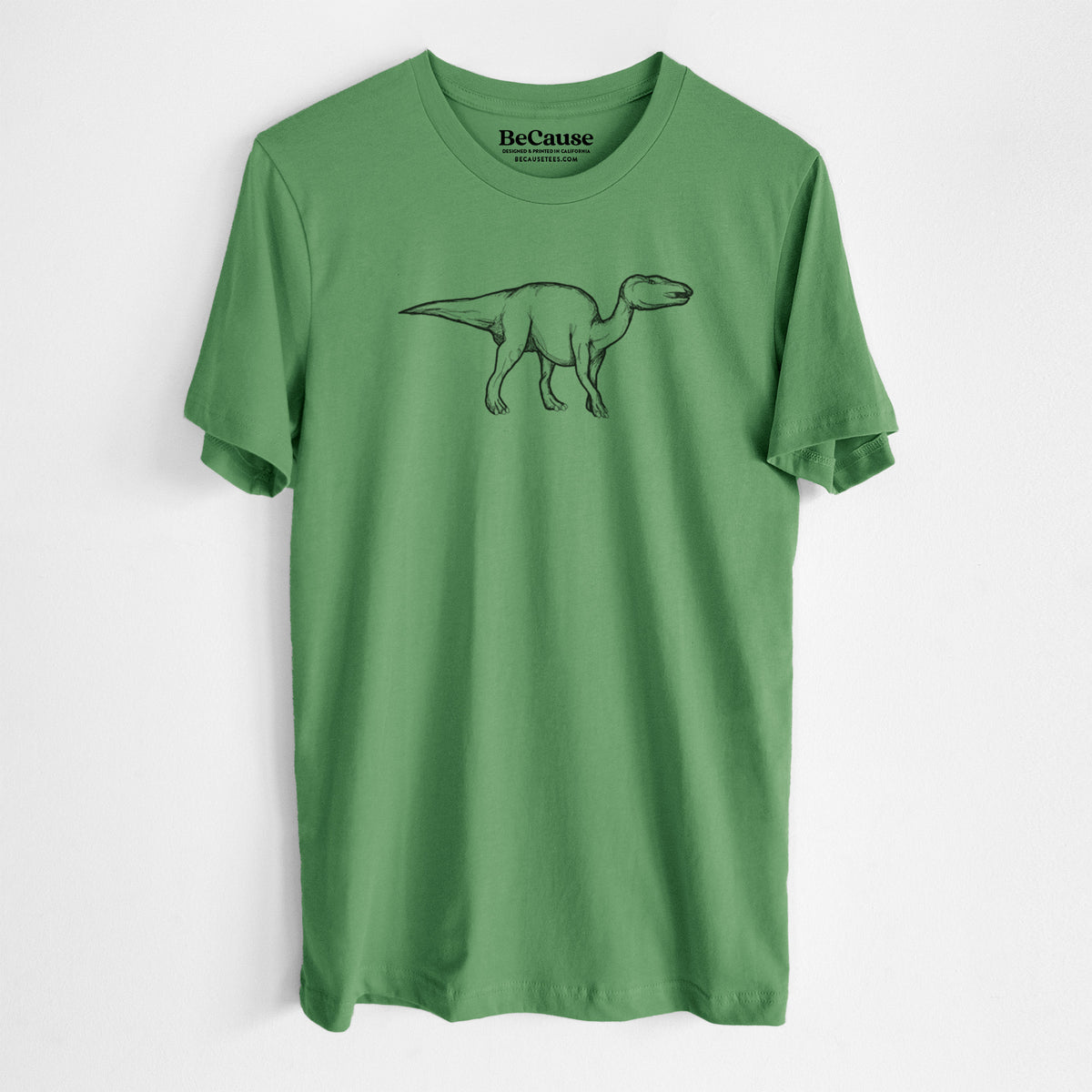 Leaf green lightweight cotton t-shirt laid flat, printed with a black ink illustration of an Edmontosaurus walking.