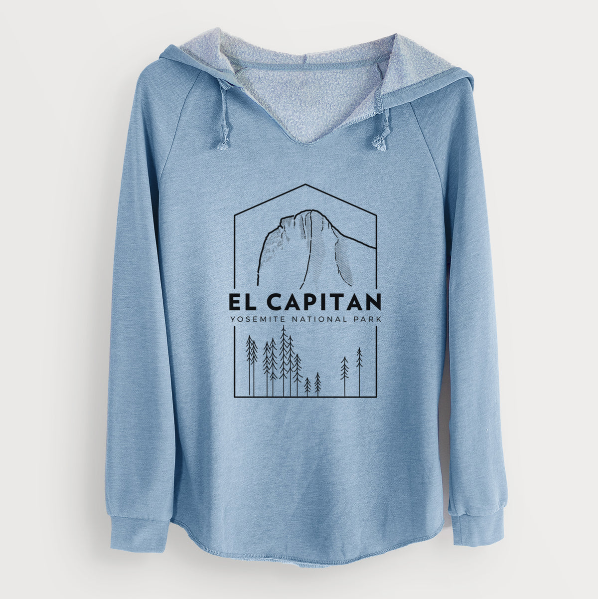 Misty blue women's Cali Wave hooded sweatshirt laid flat, printed with a black line art badge of El Capitan rising above a pine forest, with the words El Capitan, Yosemite National Park.