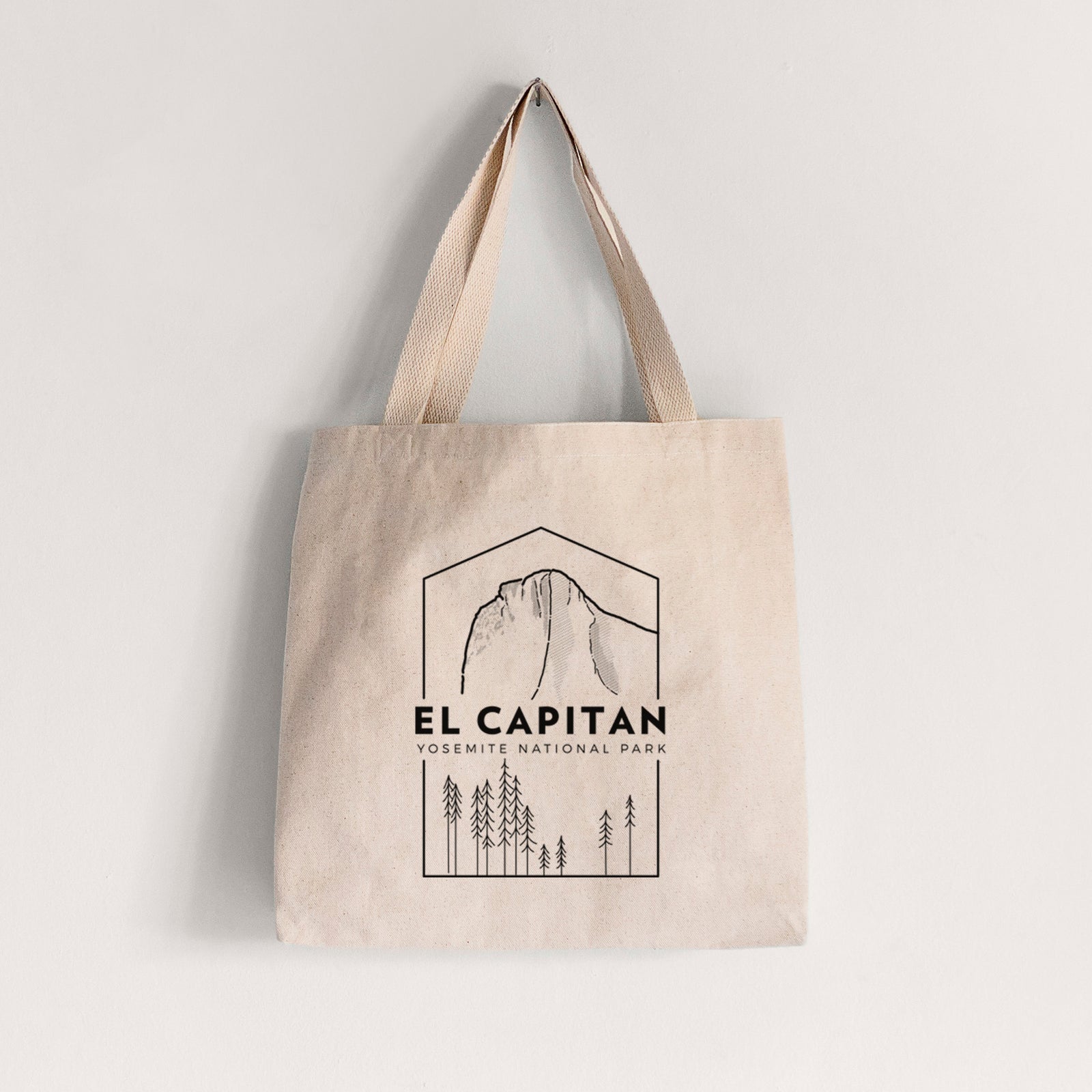 Natural canvas tote bag printed with a black line art badge of El Capitan rising above a pine forest, with the words El Capitan, Yosemite National Park.