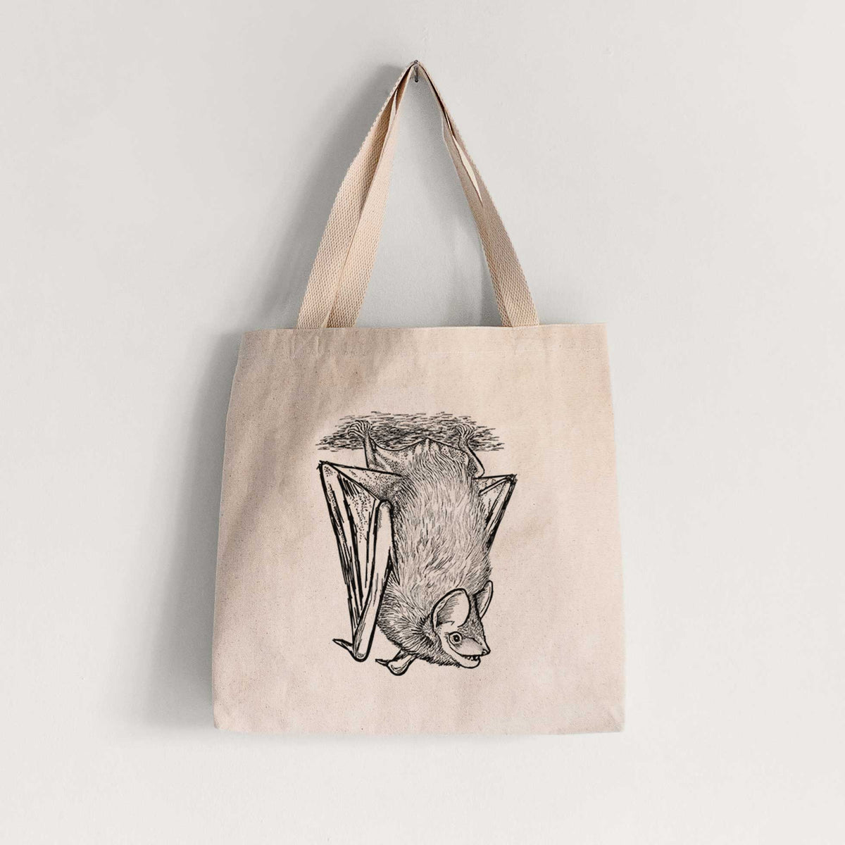 Natural canvas tote bag printed with a detailed black ink illustration of a big brown bat hanging upside down.