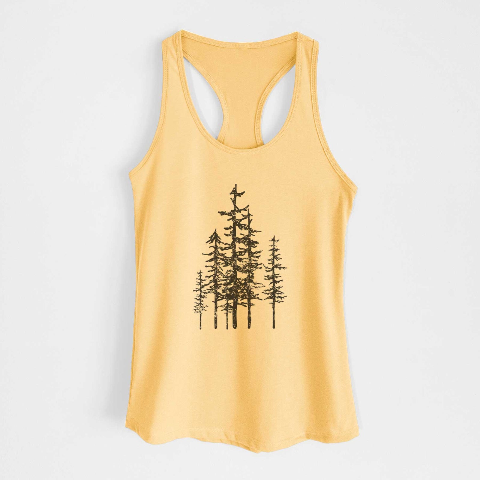 Banana cream women's racerback tank top laid flat, printed with a black ink illustration of a cluster of evergreen trees of varying heights.