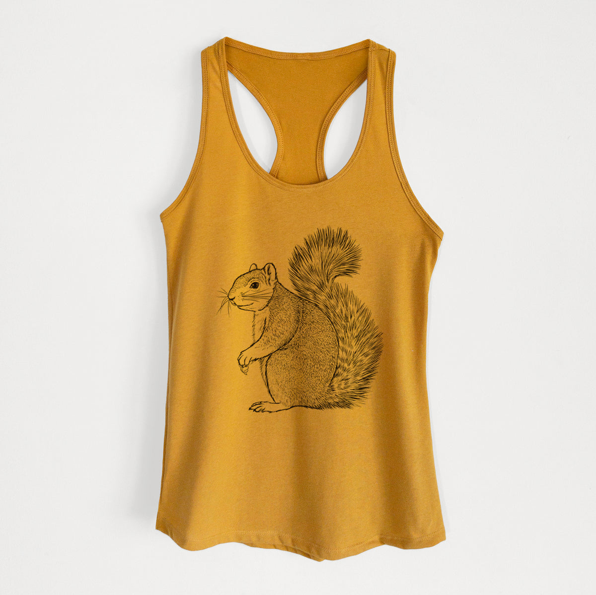 Gold women's racerback tank top laid flat, printed with a detailed black ink illustration of a fox squirrel sitting with a bushy tail.