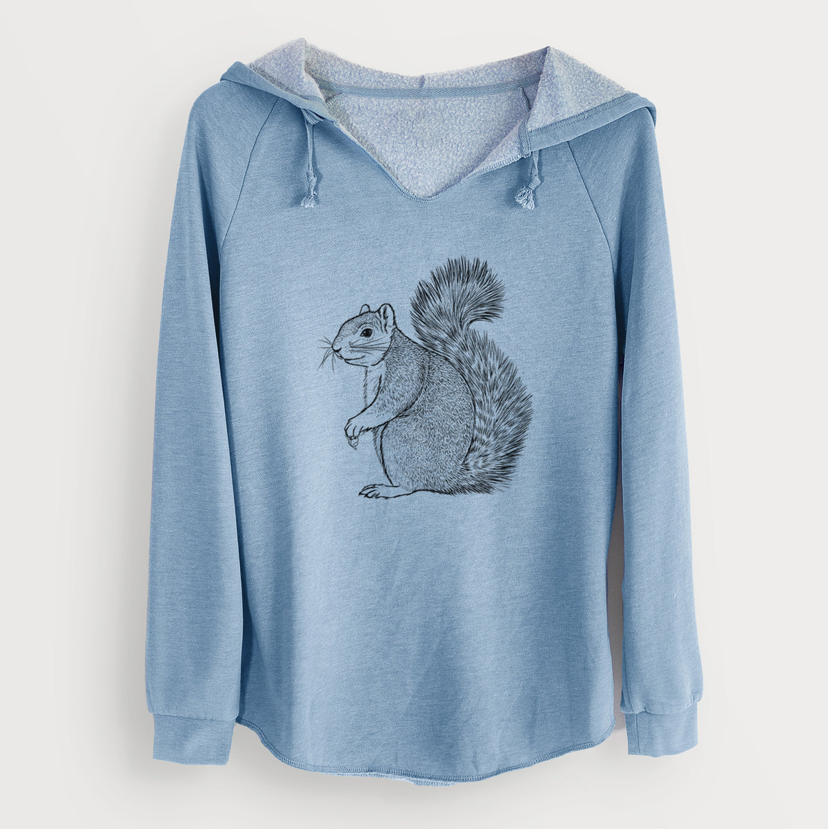 Misty blue women's Cali Wave hooded sweatshirt laid flat, printed with a detailed black ink illustration of a fox squirrel sitting with a bushy tail.