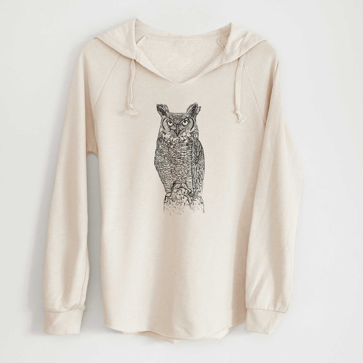 Bone cream women's Cali Wave hooded sweatshirt laid flat, printed with a detailed black ink illustration of a great horned owl standing upright with its ear tufts raised.