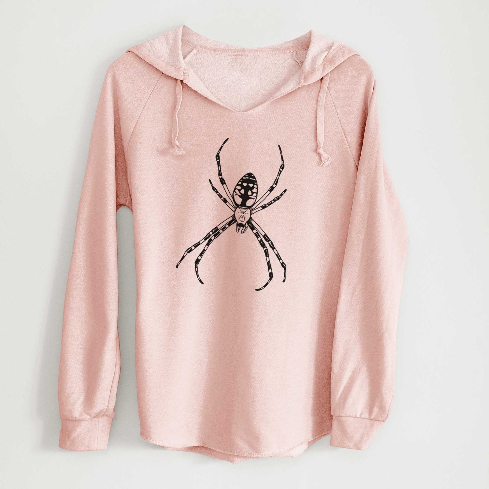 Sage green women's Cali Wave hooded sweatshirt laid flat, printed with a detailed black ink illustration of a garden spider with long striped legs.