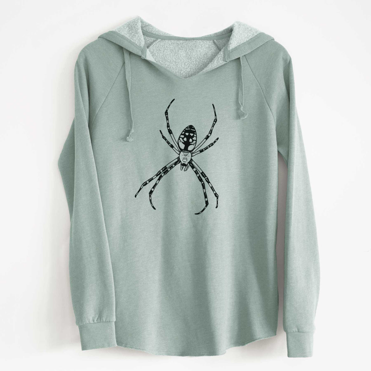 Sage green women's Cali Wave hooded sweatshirt laid flat, printed with a detailed black ink illustration of a garden spider with long striped legs.