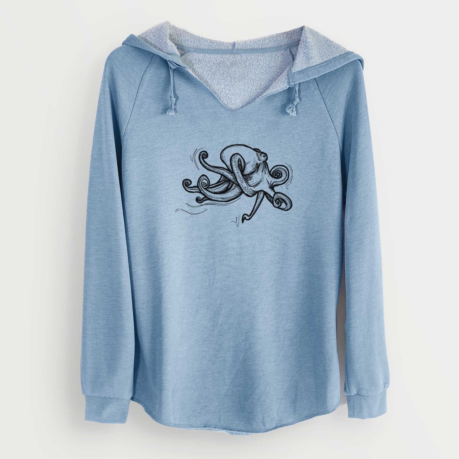 Sage green women's Cali Wave hooded sweatshirt laid flat, printed with a black ink illustration of a giant Pacific octopus with curling tentacles.