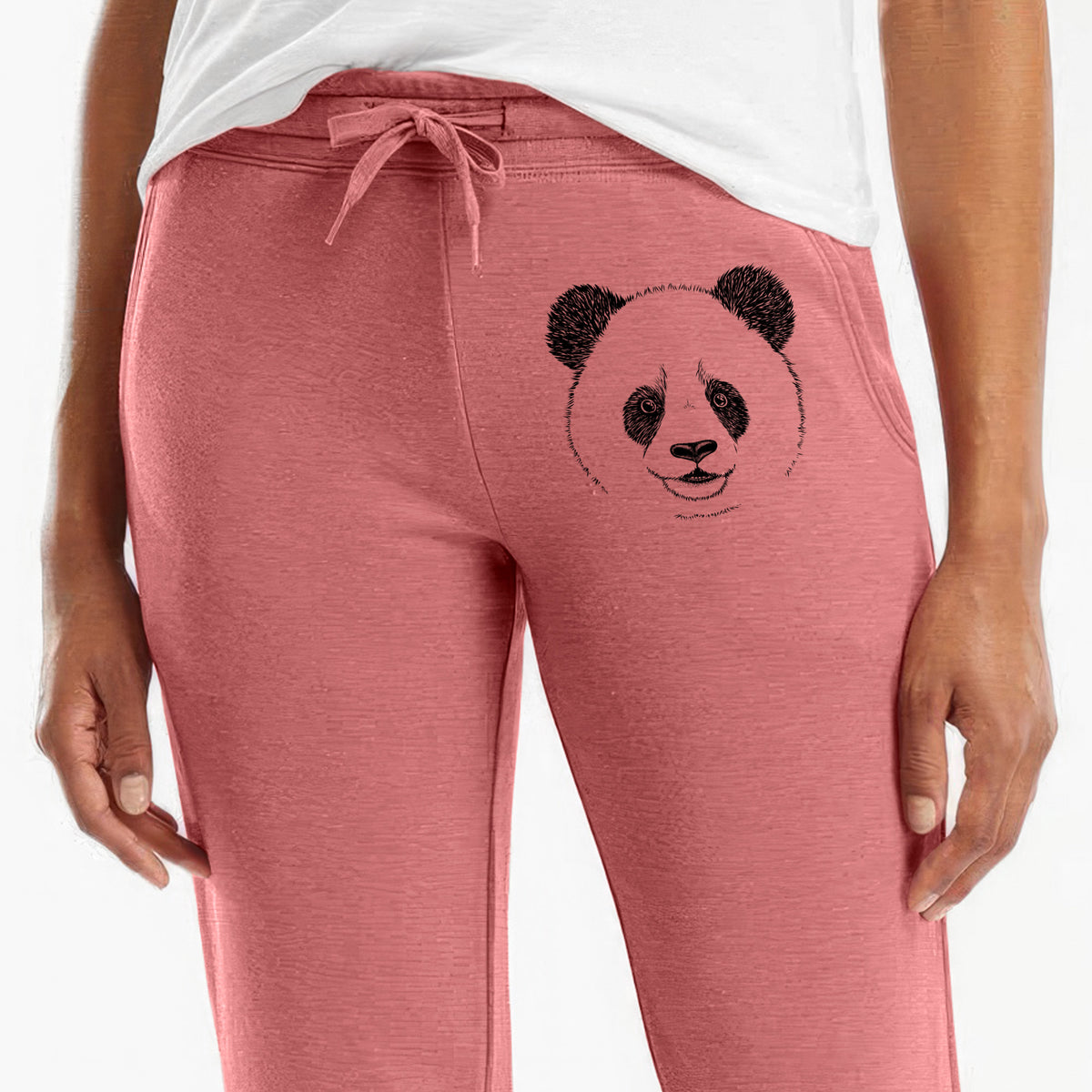 Front of dusty rose Cali Wave sweatpants, printed with a black ink portrait of a smiling giant panda's face on the leg.