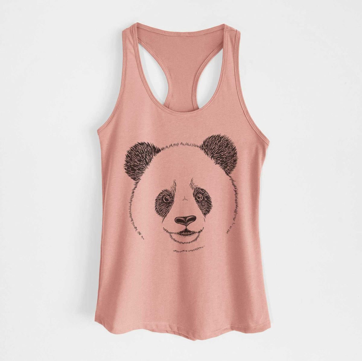 Desert pink women's racerback tank top laid flat, printed with a black ink portrait of a smiling giant panda's face.