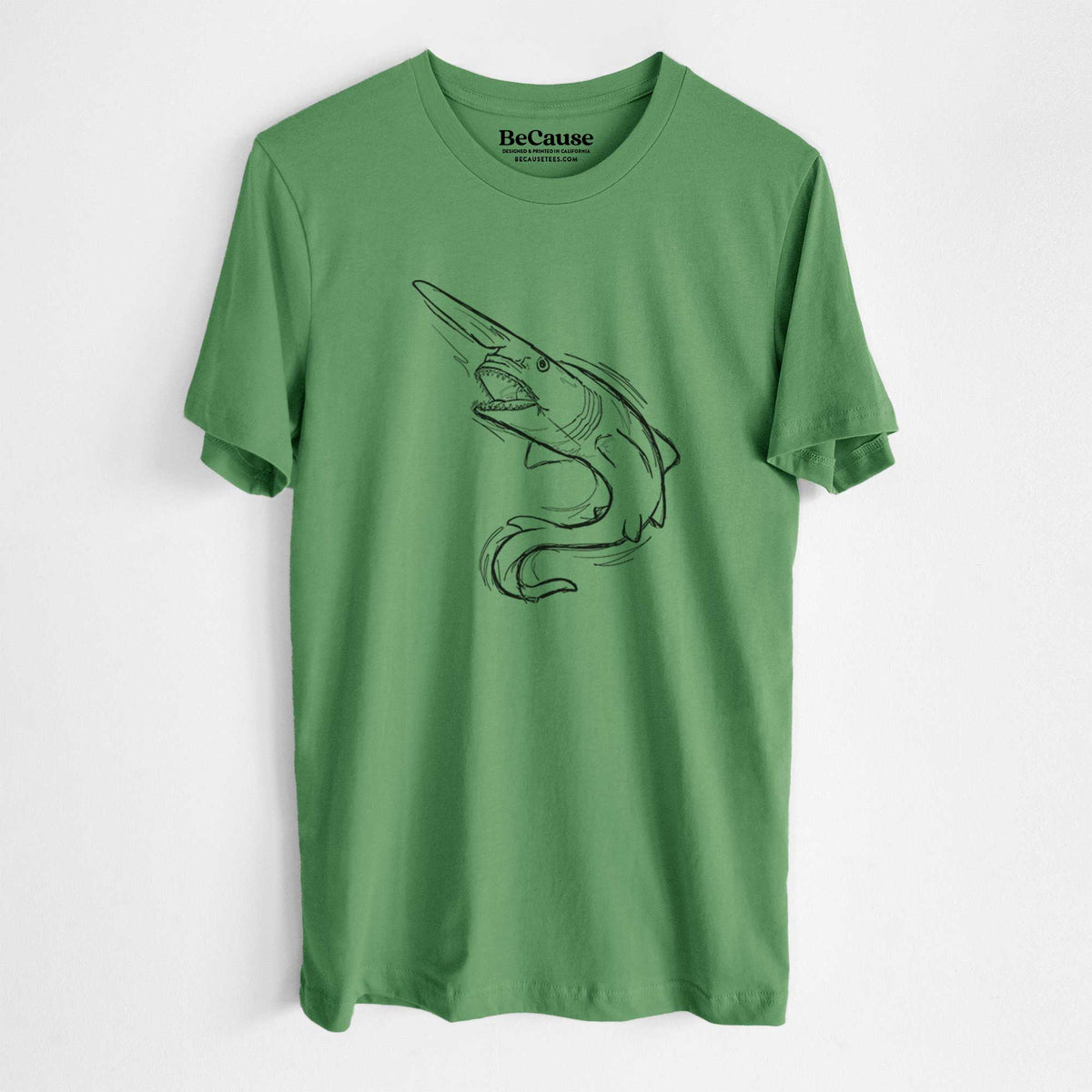 Leaf green lightweight cotton t-shirt laid flat, printed with a black ink illustration of a goblin shark with its long snout, swimming in a curve.
