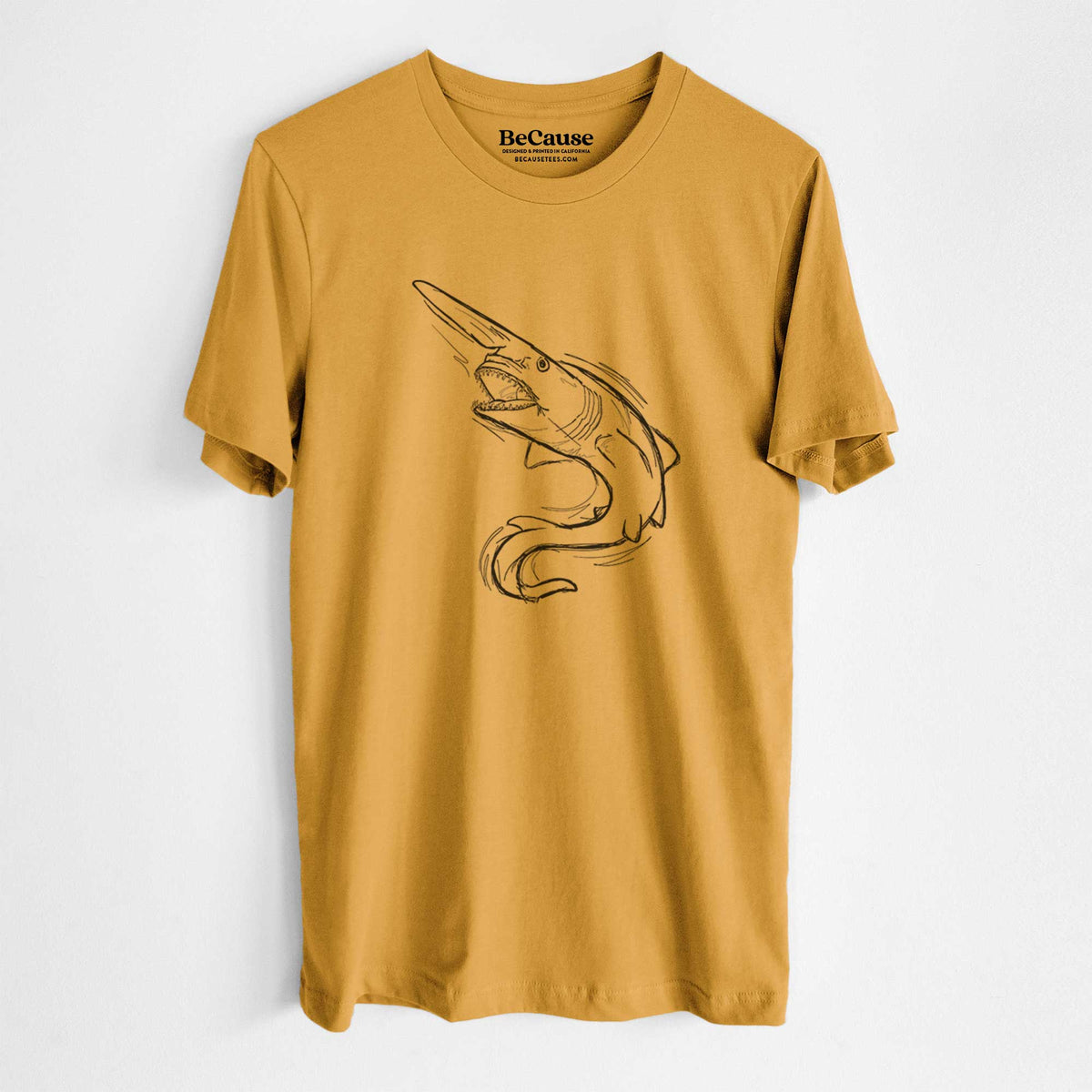 Mustard yellow lightweight cotton t-shirt laid flat, printed with a black ink illustration of a goblin shark with its long snout, swimming in a curve.