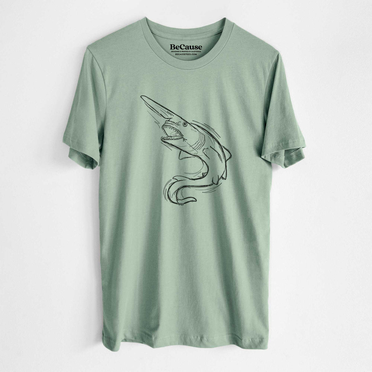 Sage green lightweight cotton t-shirt laid flat, printed with a black ink illustration of a goblin shark with its long snout, swimming in a curve.