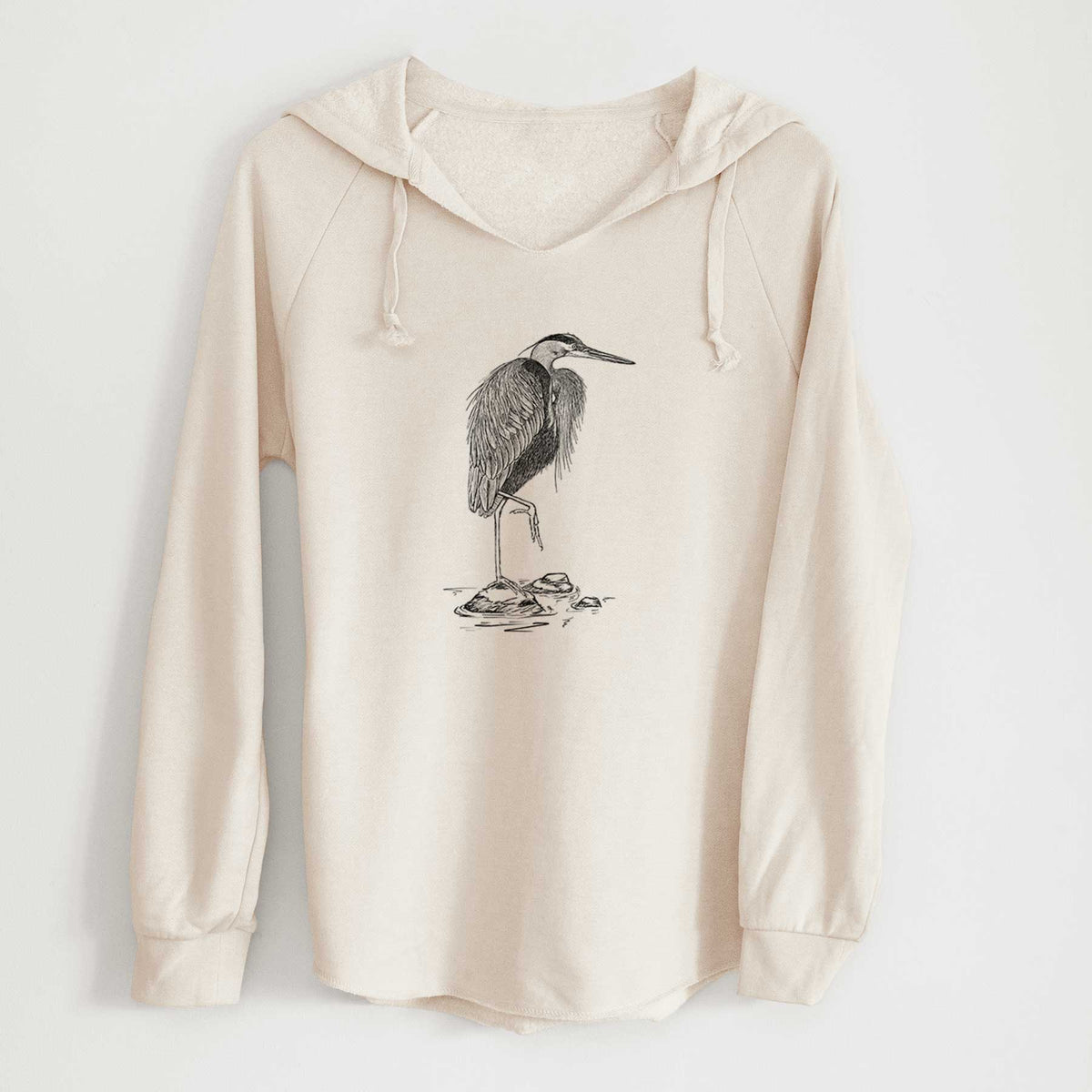 Bone cream women's Cali Wave hooded sweatshirt laid flat, printed with a detailed black ink illustration of a great blue heron standing on rocks.