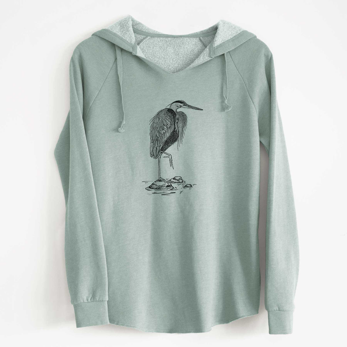 Sage green women's Cali Wave hooded sweatshirt laid flat, printed with a detailed black ink illustration of a great blue heron standing on rocks.