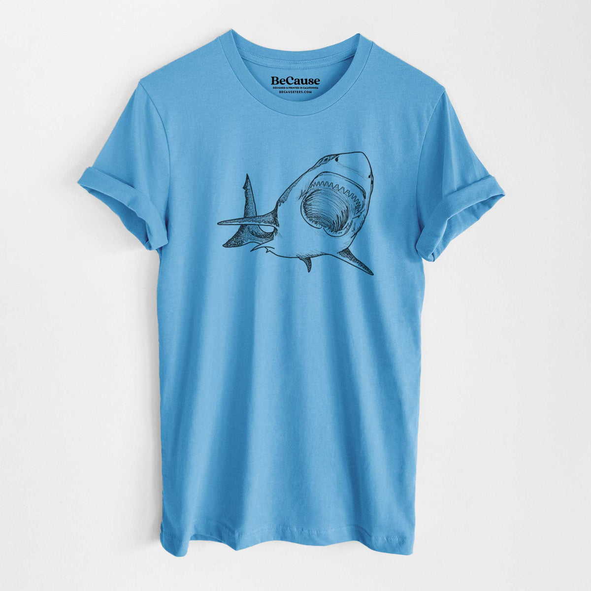 Ocean blue lightweight cotton t-shirt laid flat, printed with a black ink illustration of a great white shark swimming toward the viewer with its mouth open.