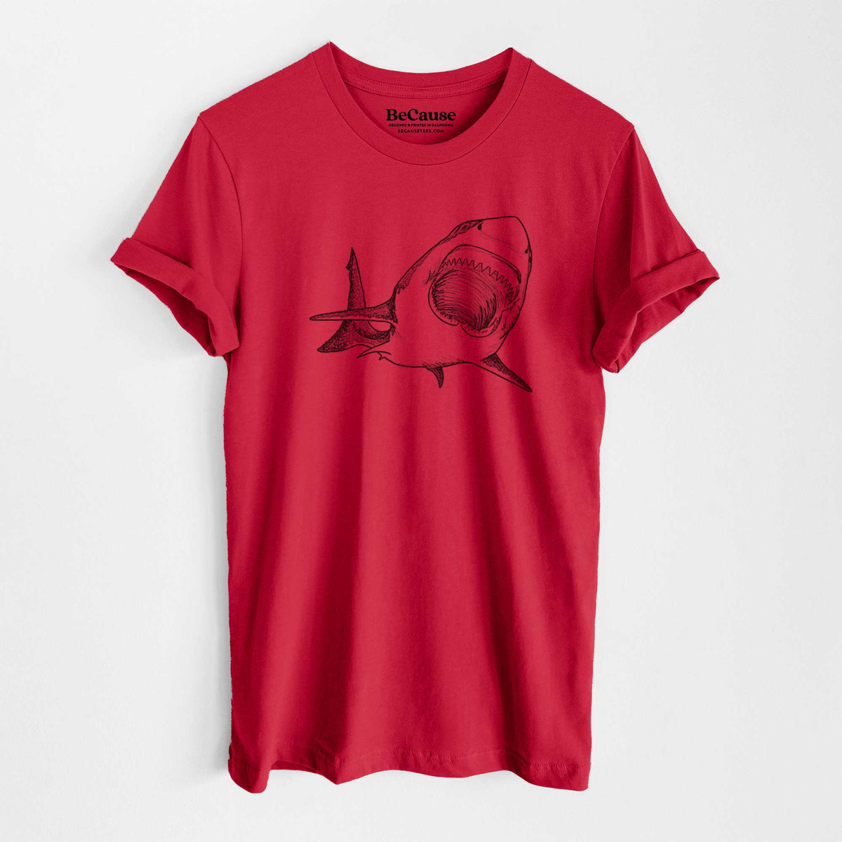 Ruby red lightweight cotton t-shirt laid flat, printed with a black ink illustration of a great white shark swimming toward the viewer with its mouth open.