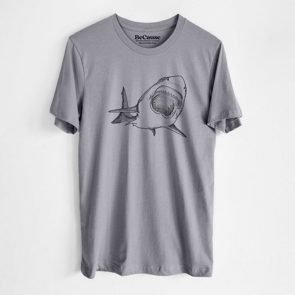 Storm grey lightweight cotton t-shirt laid flat, printed with a black ink illustration of a great white shark swimming toward the viewer with its mouth open.