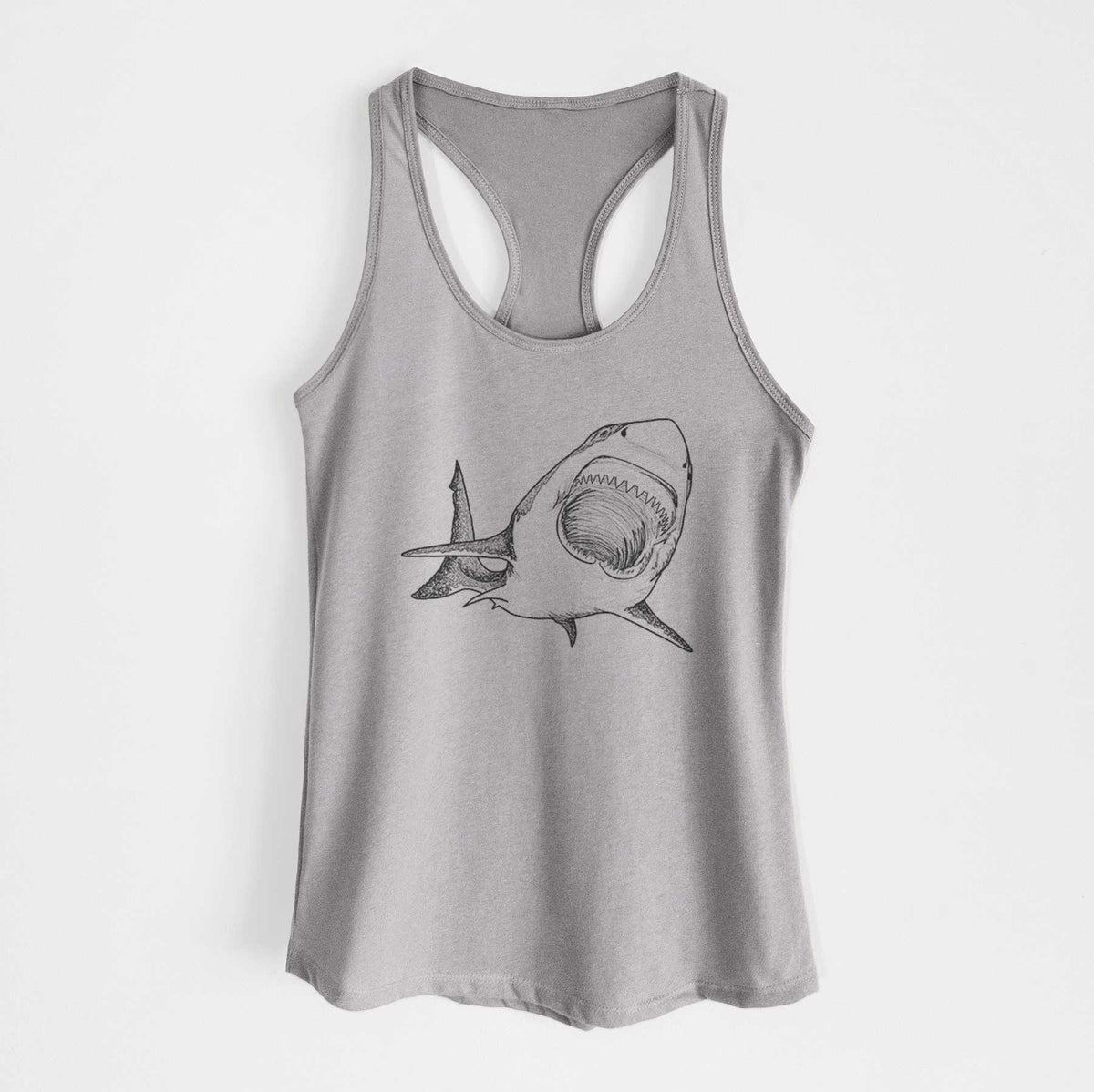 Heather grey women's racerback tank top laid flat, printed with a black ink illustration of a great white shark swimming toward the viewer with its mouth open.