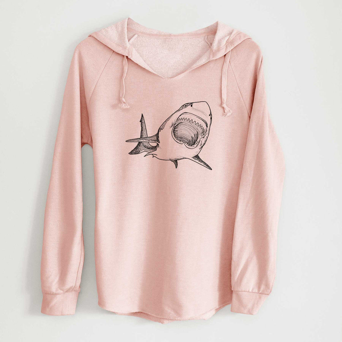Blush pink women's Cali Wave hooded sweatshirt laid flat, printed with a black ink illustration of a great white shark swimming toward the viewer with its mouth open.