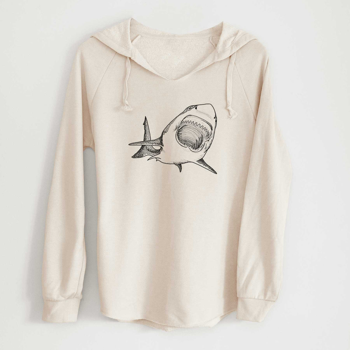 Bone cream women's Cali Wave hooded sweatshirt laid flat, printed with a black ink illustration of a great white shark swimming toward the viewer with its mouth open.