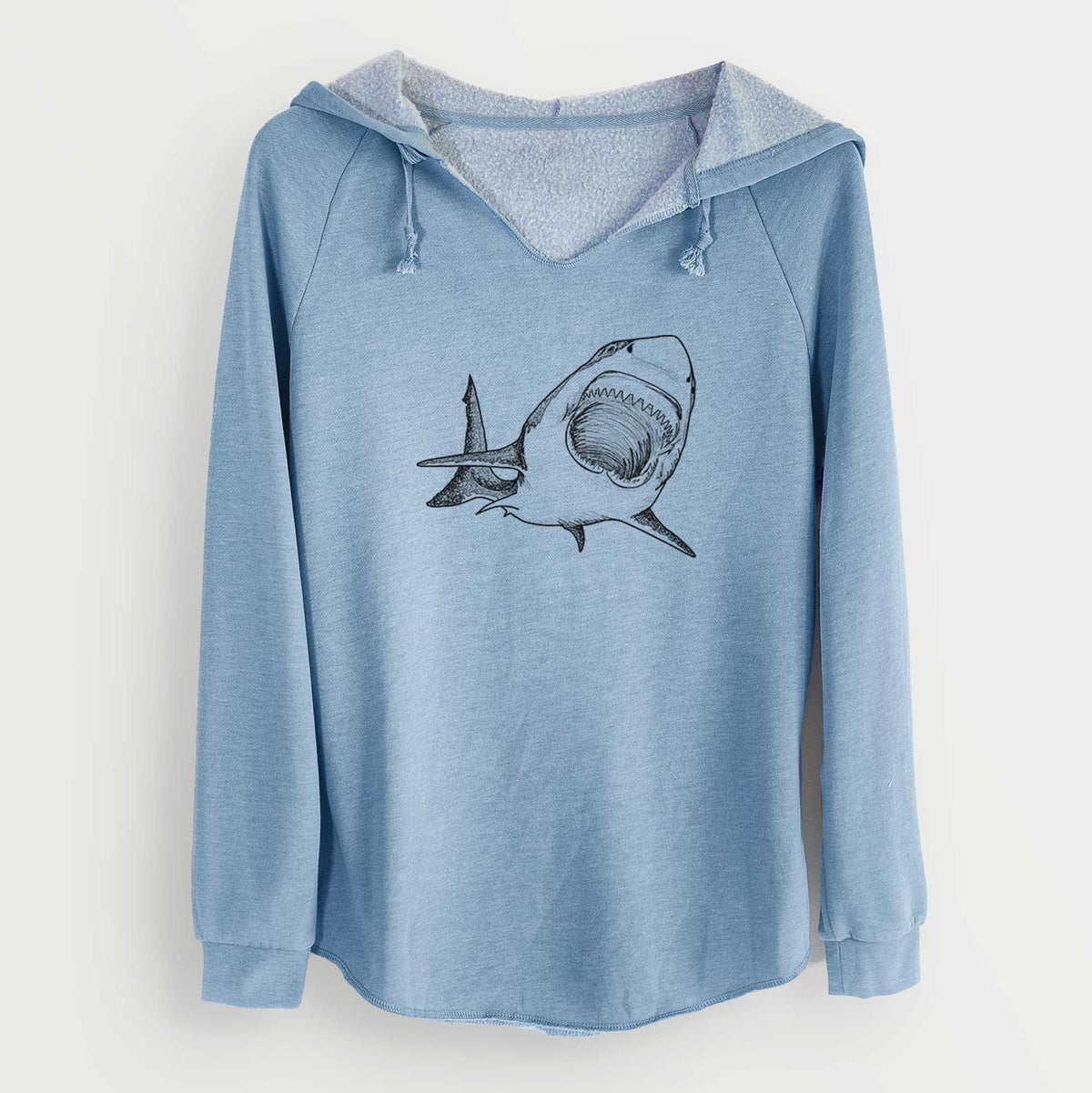 Misty blue women's Cali Wave hooded sweatshirt laid flat, printed with a black ink illustration of a great white shark swimming toward the viewer with its mouth open.